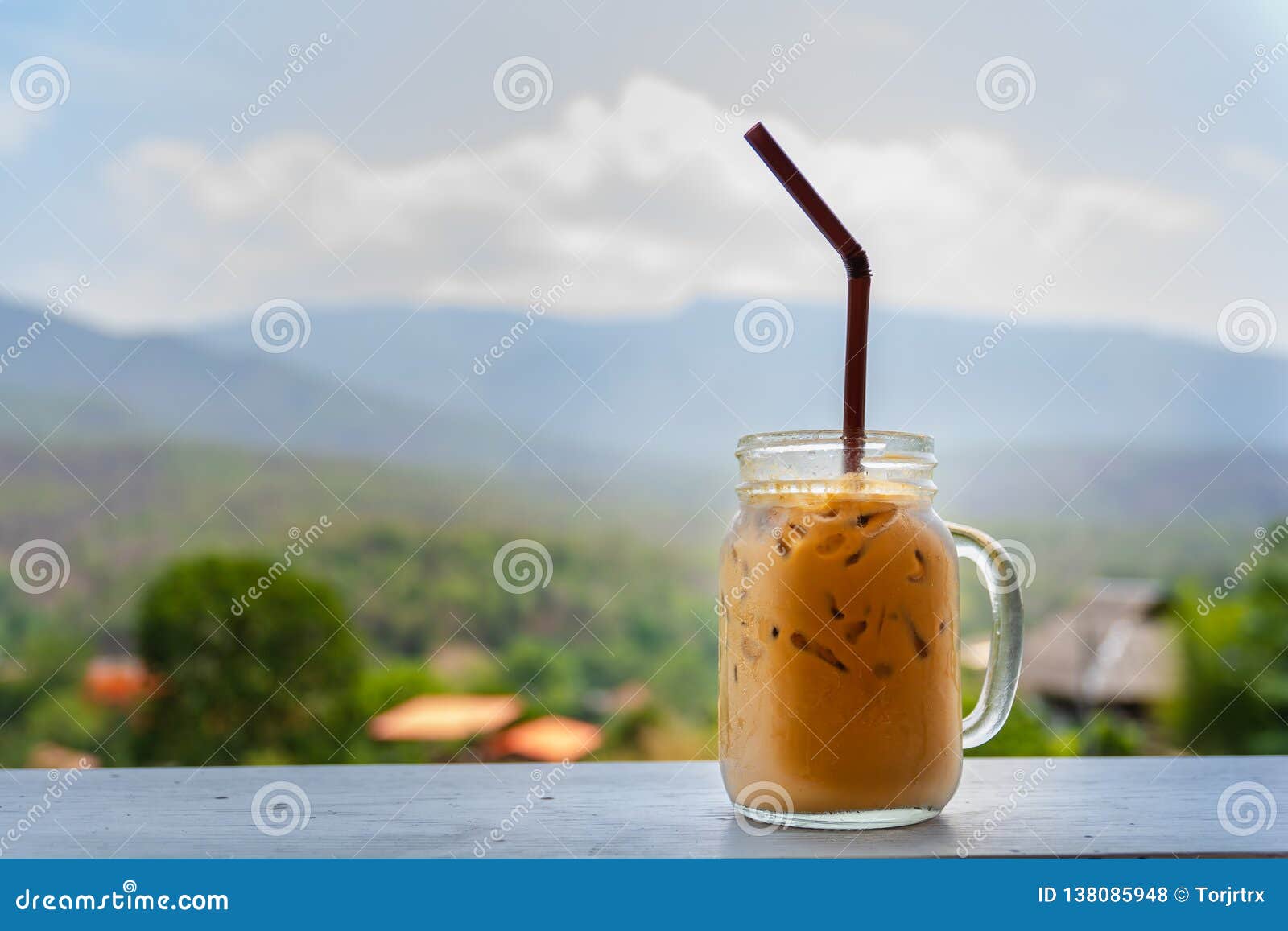 Fresh Cool Ice Coffee Cup with Mountain Background for Refreshment in a Hot  Day Stock Photo - Image of frozen, brown: 138085948