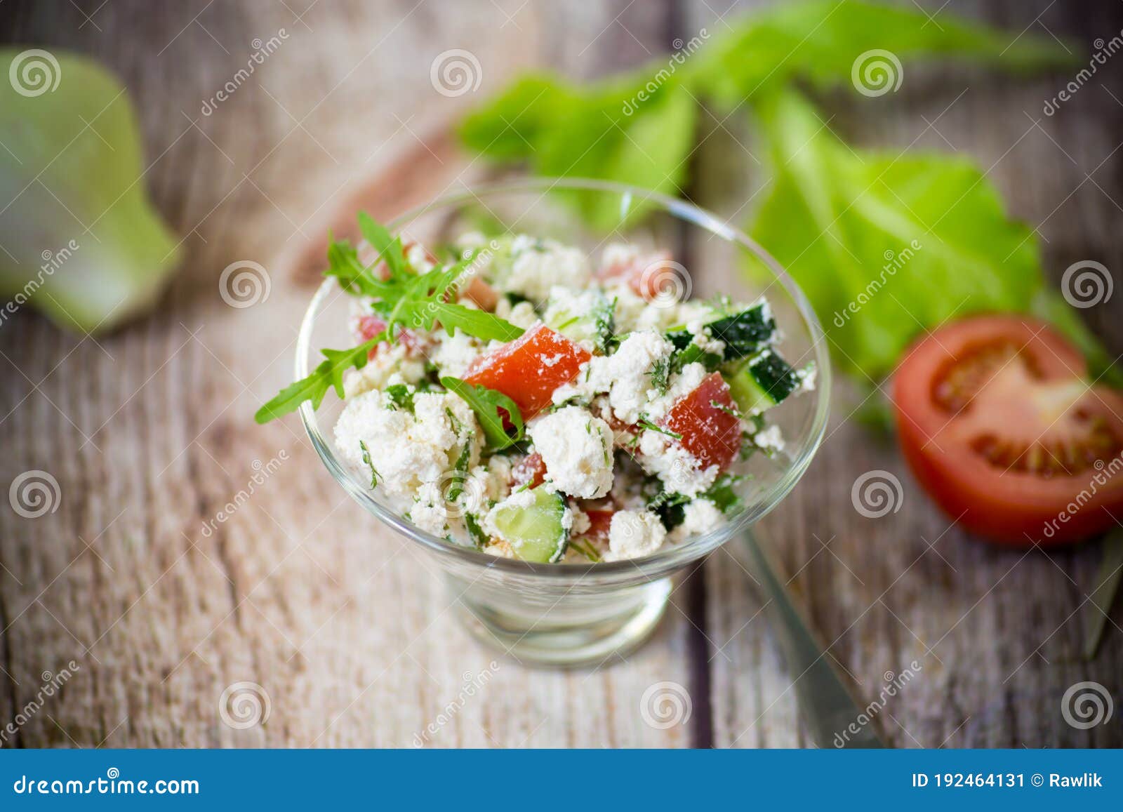 Fresh Cottage Cheese Salad with Cucumbers and Tomatoes with Herbs in a