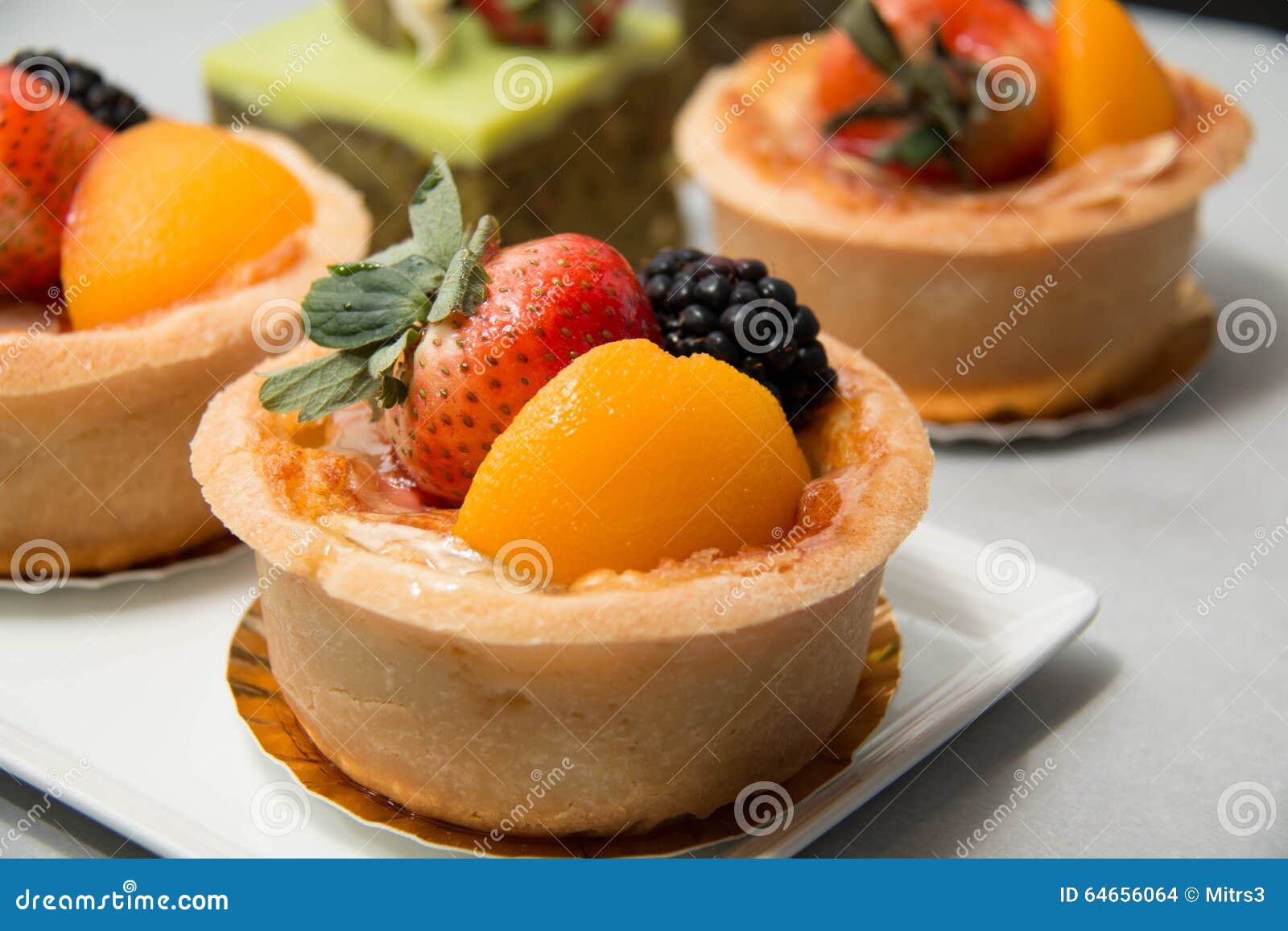 Fresh Dessert Fruit Tart in Assorted Tropical Fruits Stock Photo