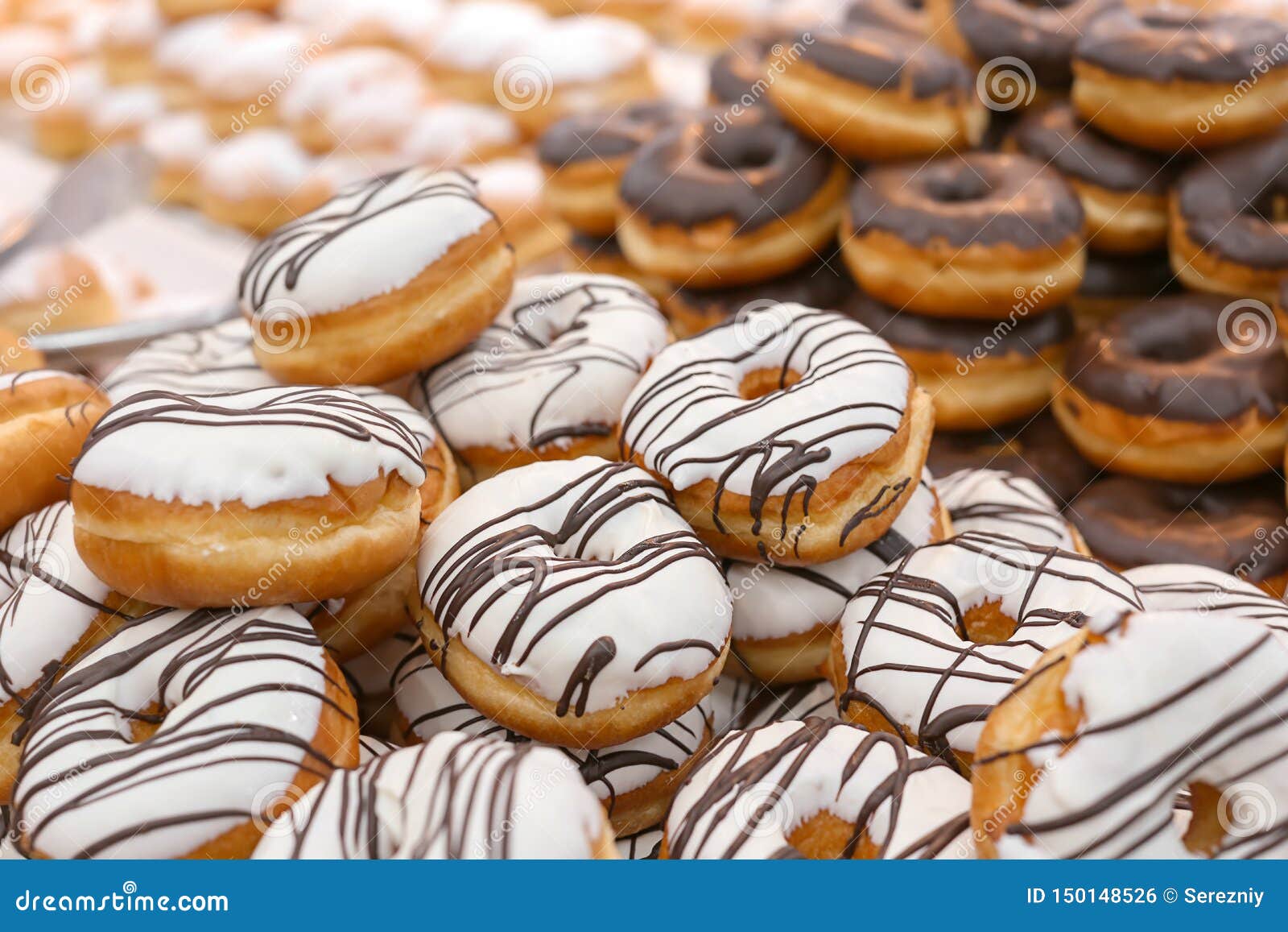 Fresh donuts in bakery stock photo. Image of dessert 150148526