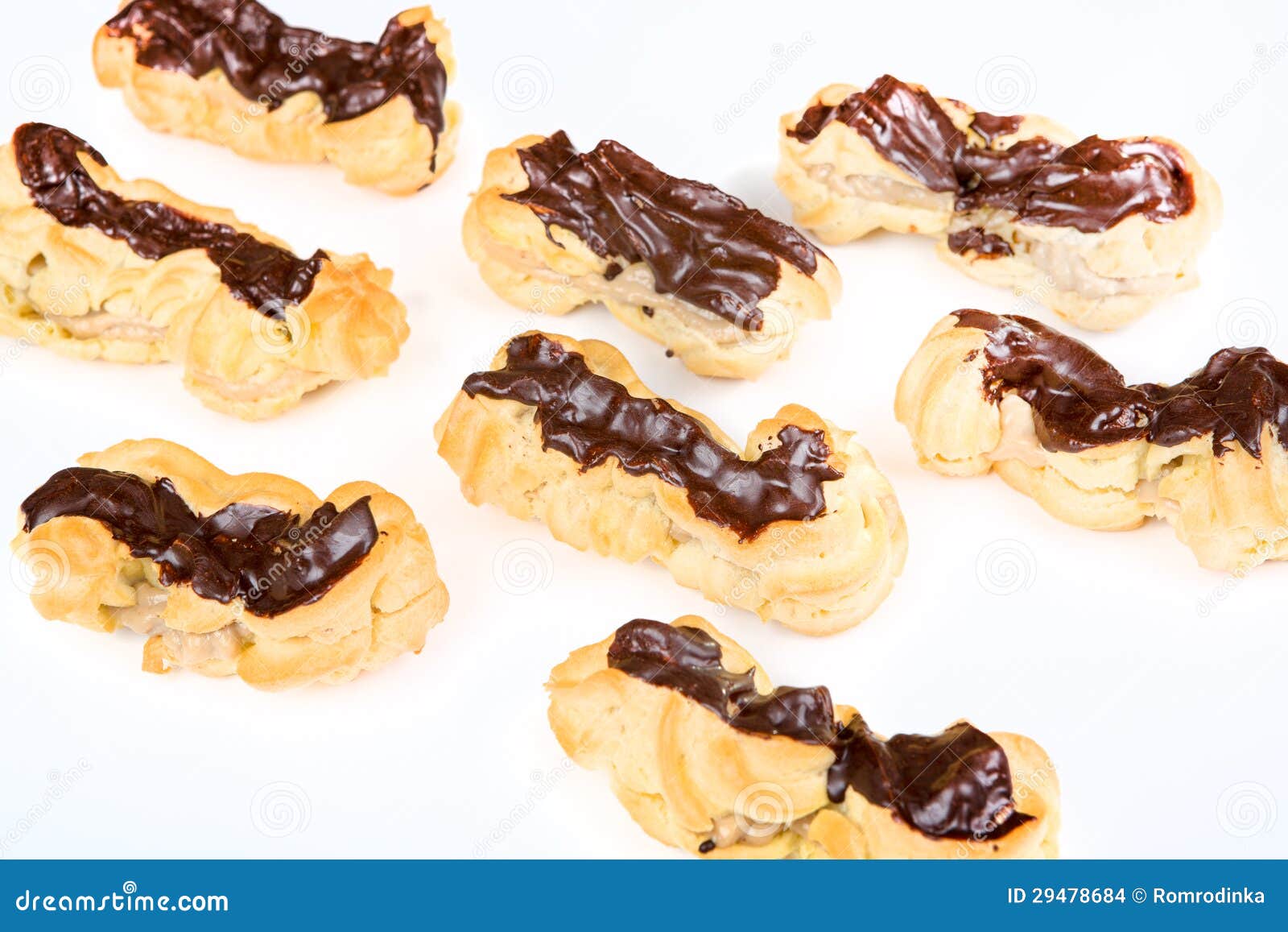 Fresh Eclairs with Coffee Cream Inside and Chocolate Stock Photo