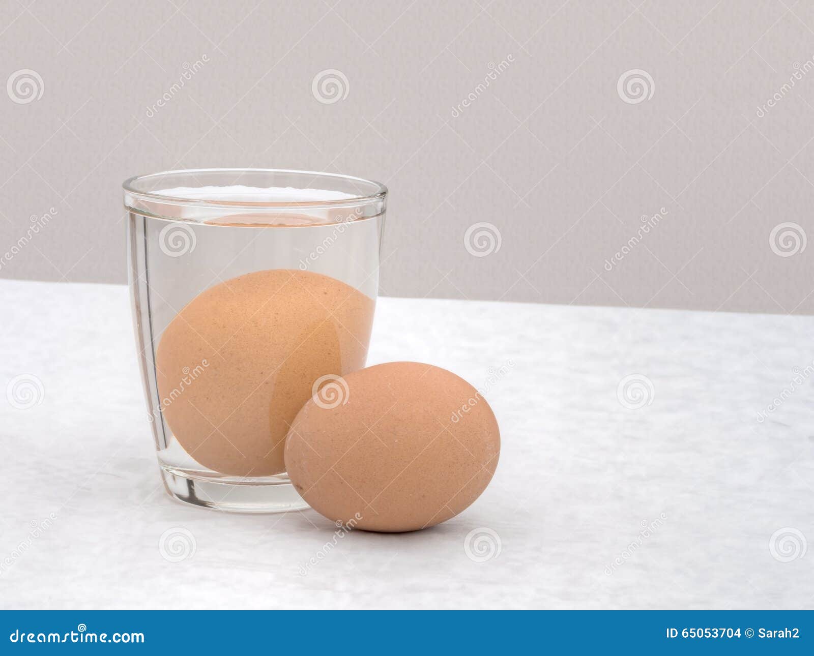 Fresh Egg Tested By Placing In Water It Sinks Stock Photo