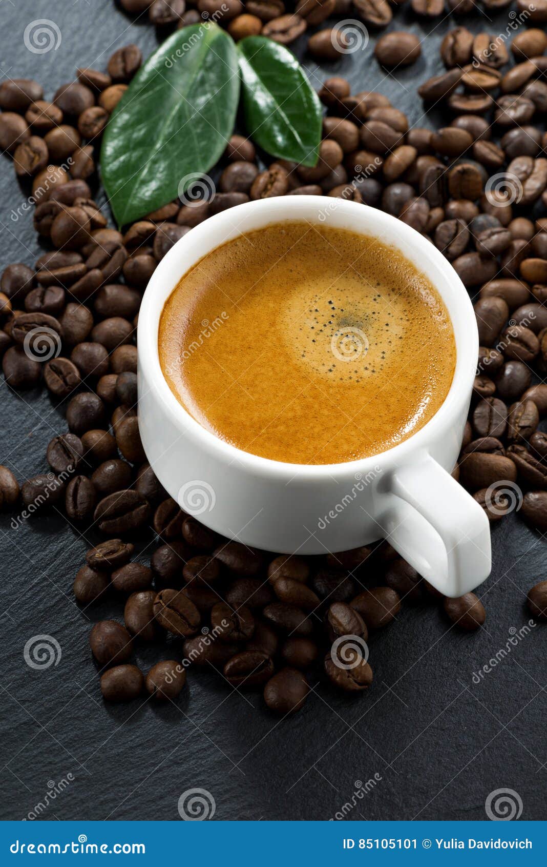 Fresh Espresso on Coffee Beans Background, Vertical, Top View Stock