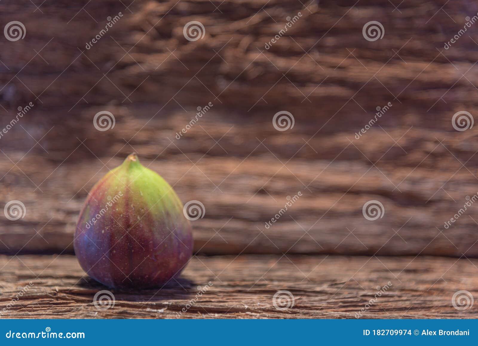 fresh fig fruits on aged wooden background