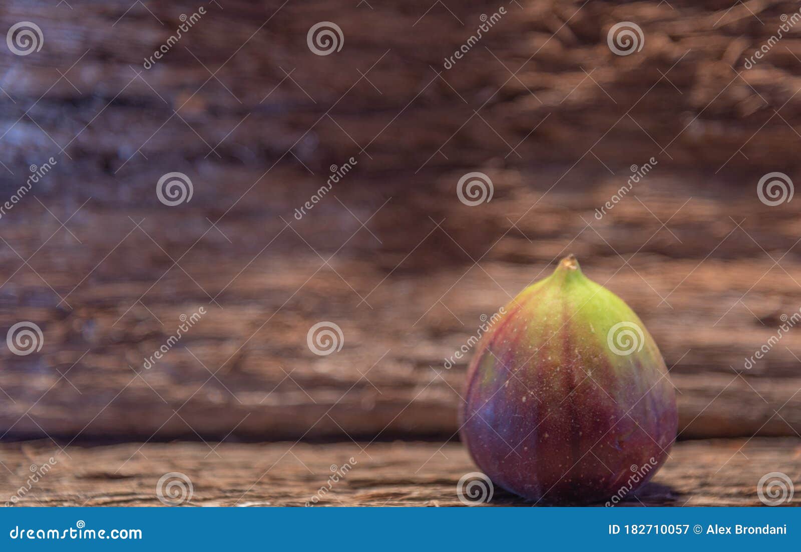 fresh fig fruits on aged wooden background
