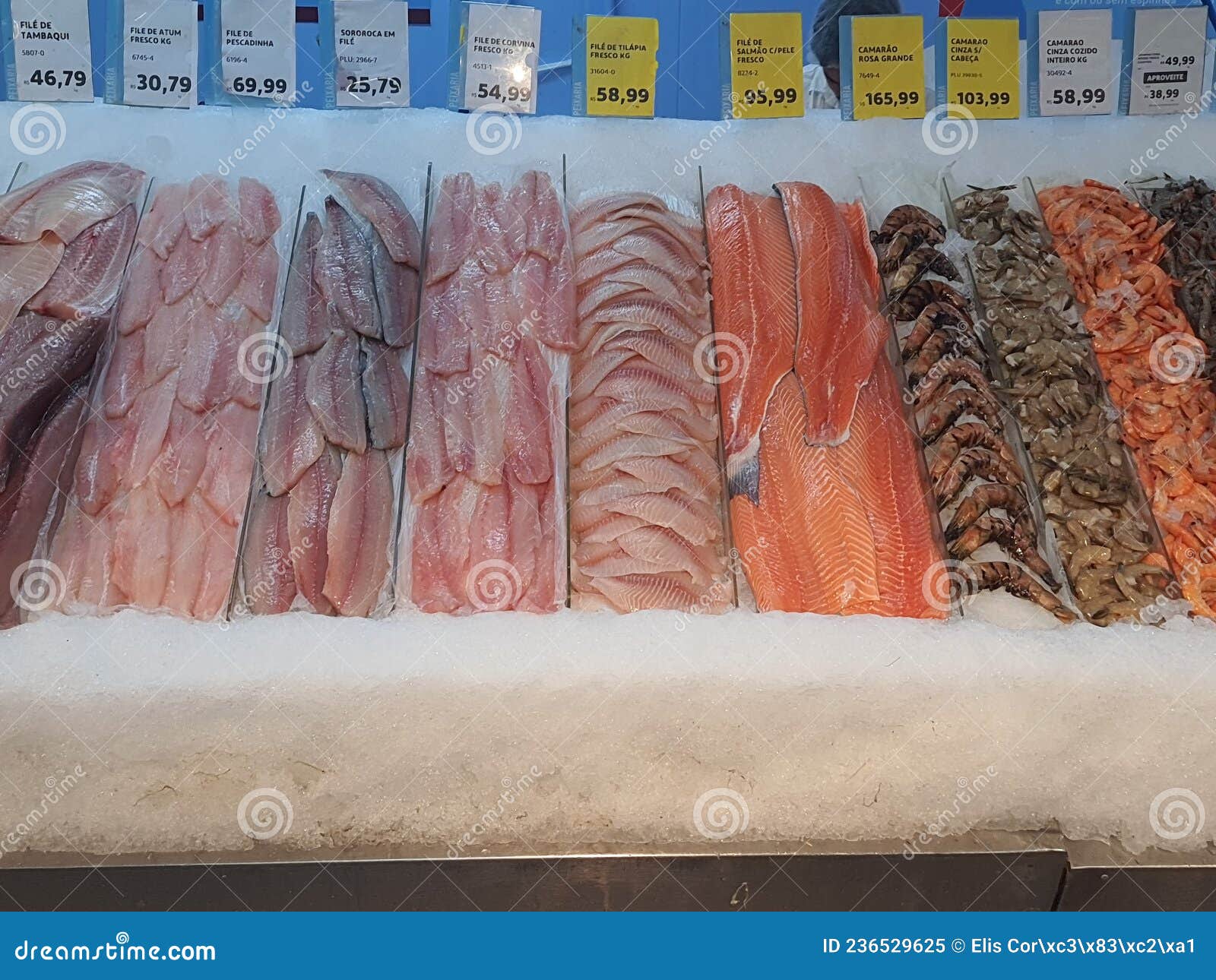 fresh fish on ice, different types, colorful, whole and fillets, in a fishmonger .