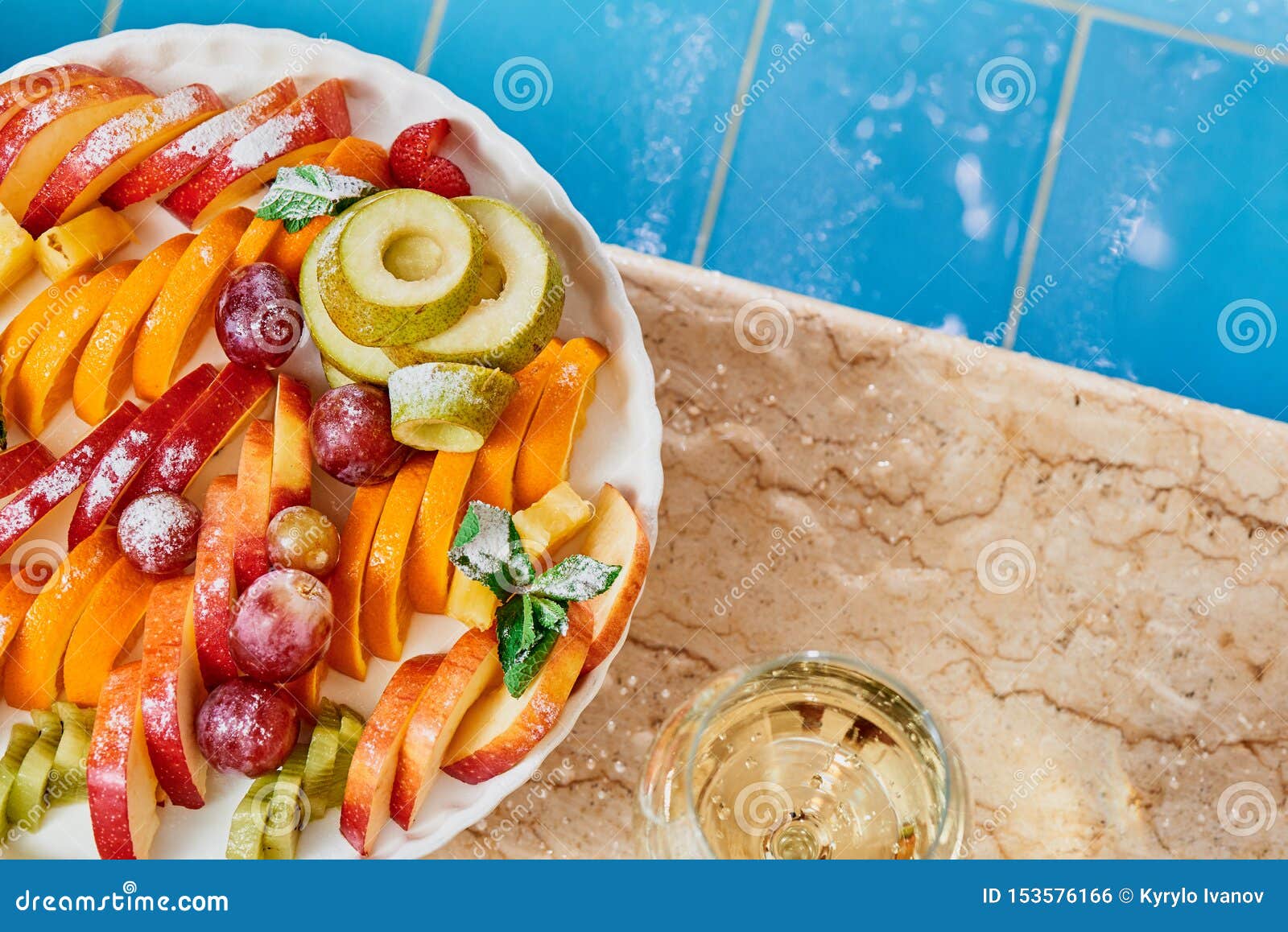 Download Fresh Fruit And A Glass Of White Wine Near The Pool With Blue Tiles Close Up Stock Photo Image Of Plate Lifestyle 153576166