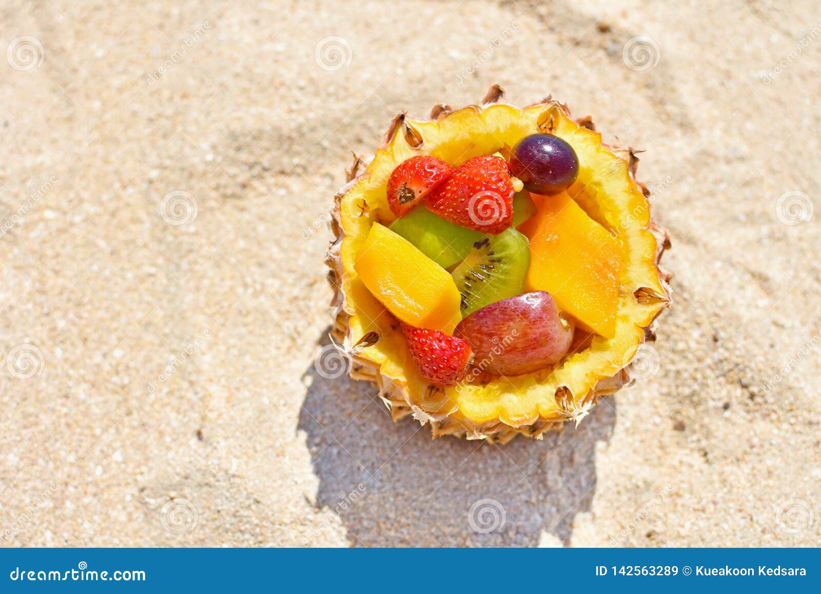Fresh Fruit Served In Pineapple Bowl On Summer Beach Stock Image