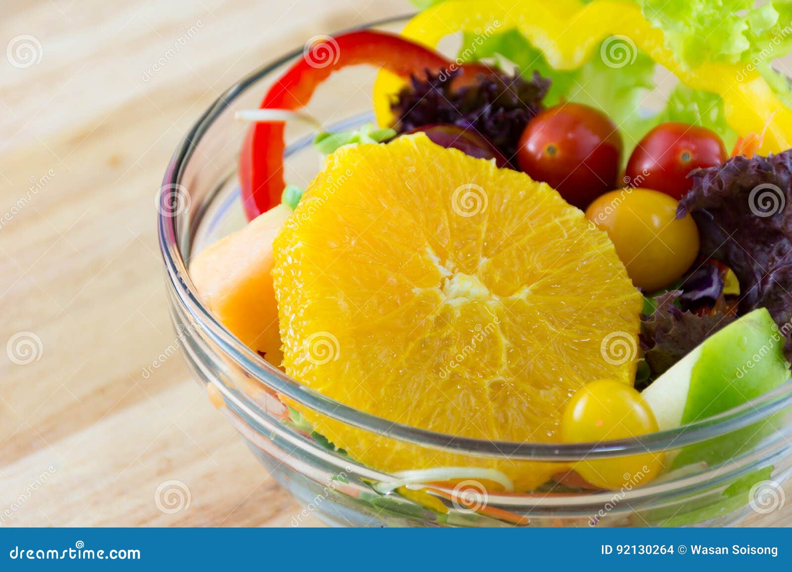 Fresh Fruit and Vegetable Salad on a Wooden Plate Stock Photo Image