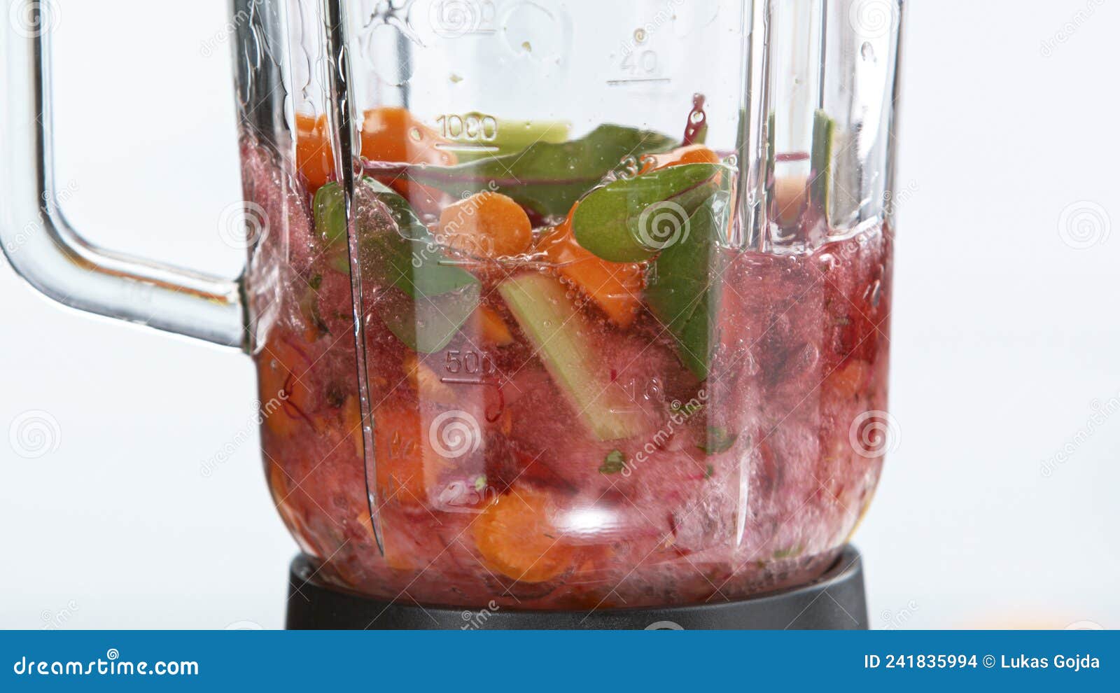 Fresh Fruit and Vegetables Smoothie Blended in Blender Stock Photo
