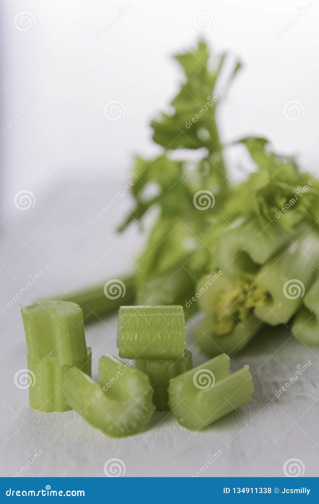 Fresh Green Celery on Grunge White Wood Background Stock Photo Image