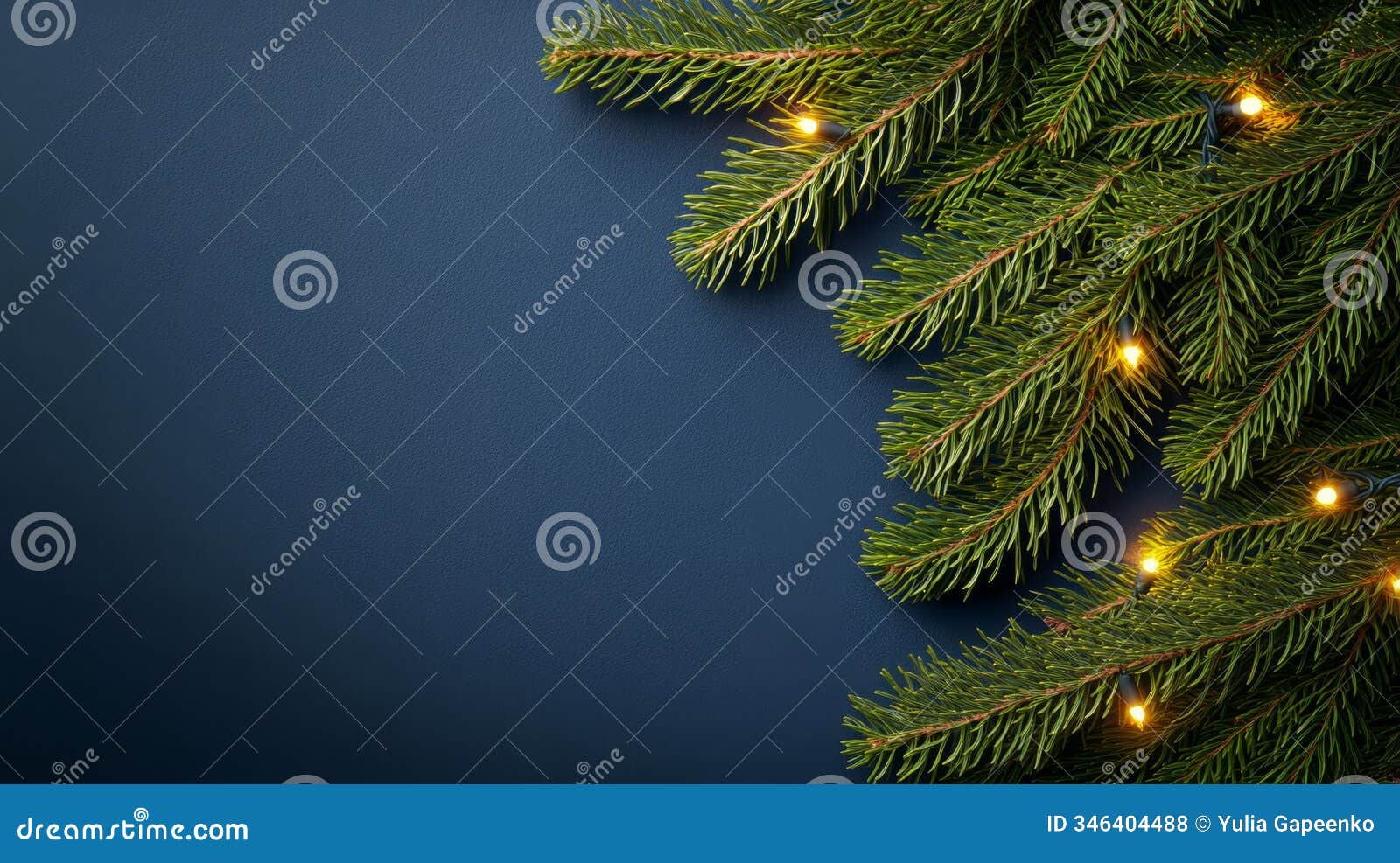 fresh green pine branches adorned with warm, glowing lights during the holiday season