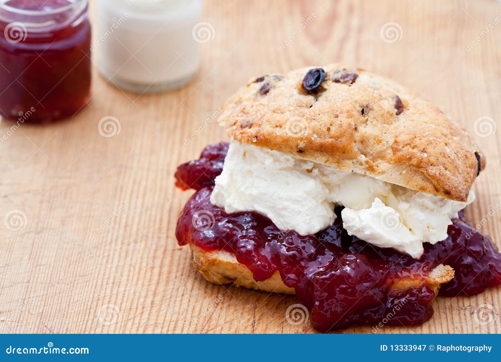 fresh home baked scone with jam and clotted cream