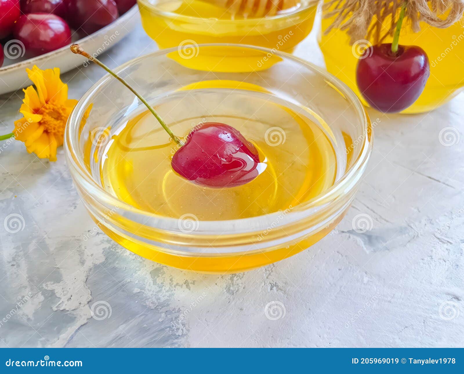 fresh honey, cherry   healthy eating   blossom  on concrete backgroundn liquid, dessert