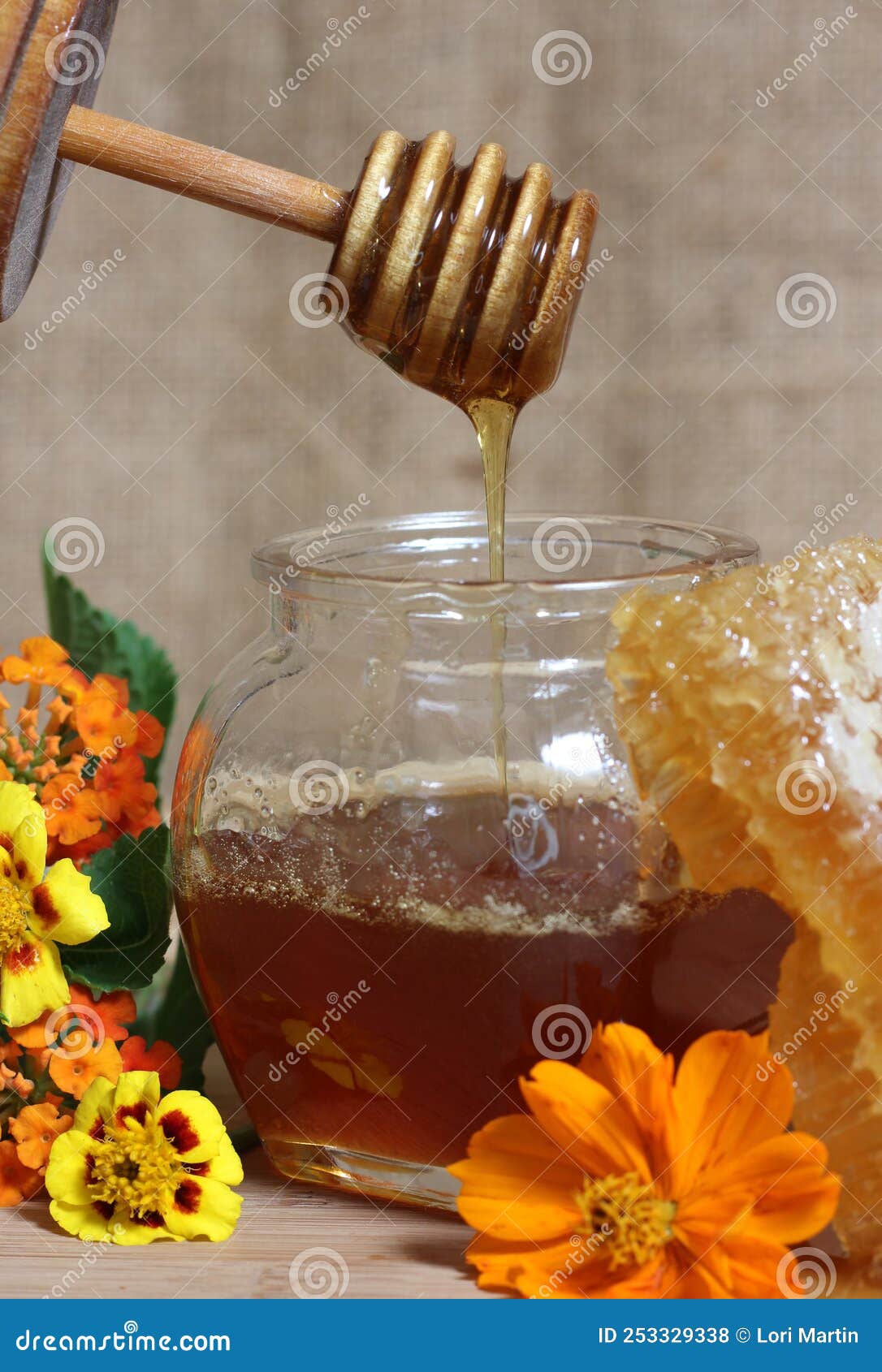 Fresh Honey with and Flowers in Rustic Kitchen Stock Photo