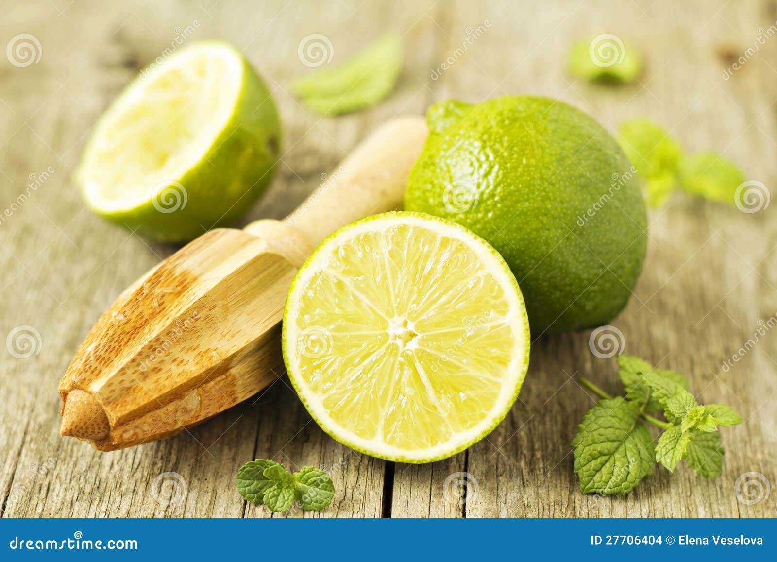 Fresh limes with a reamer stock photo. Image of cooking 27706404