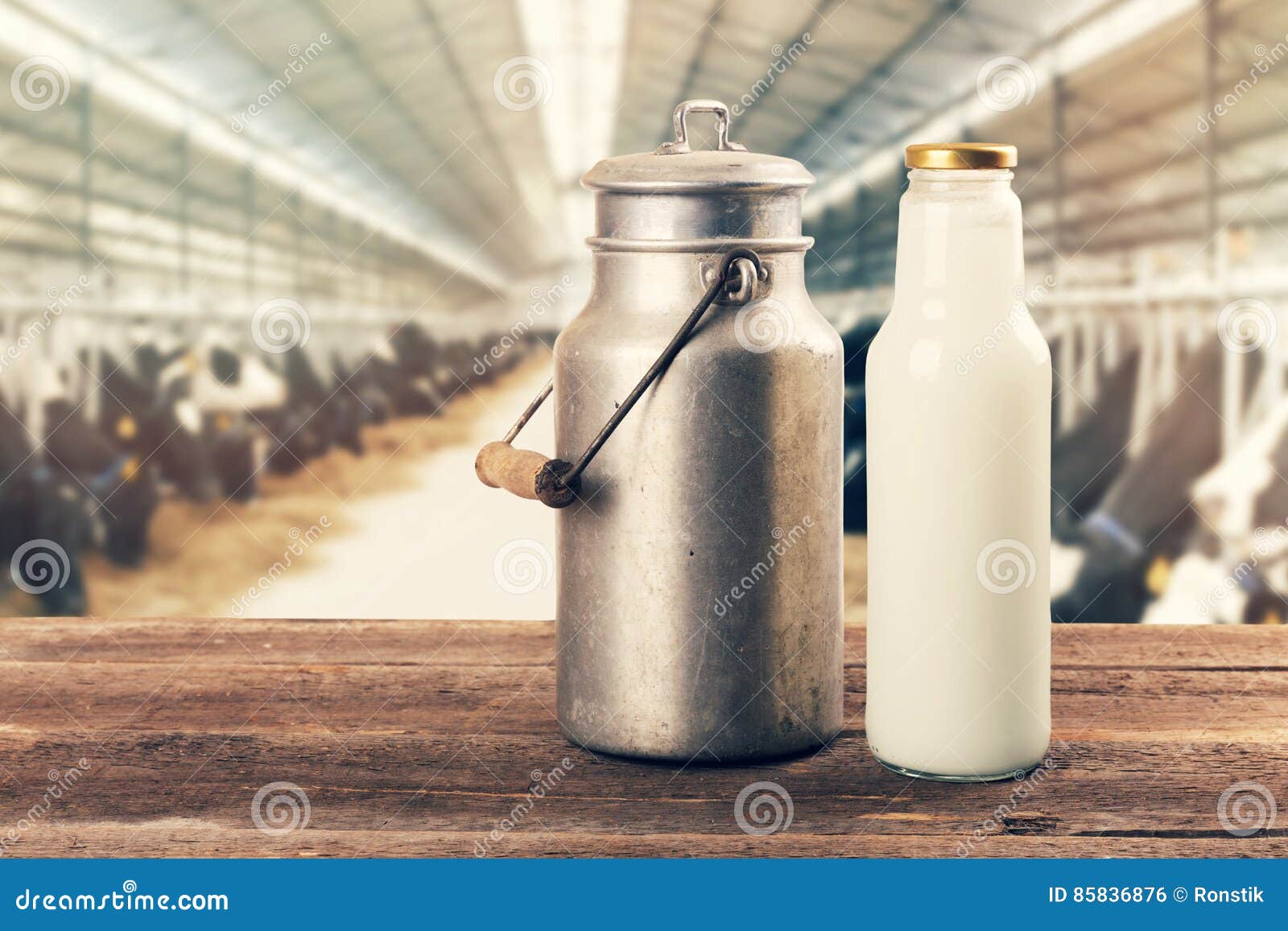 fresh milk bottle and can on the table in cowshed