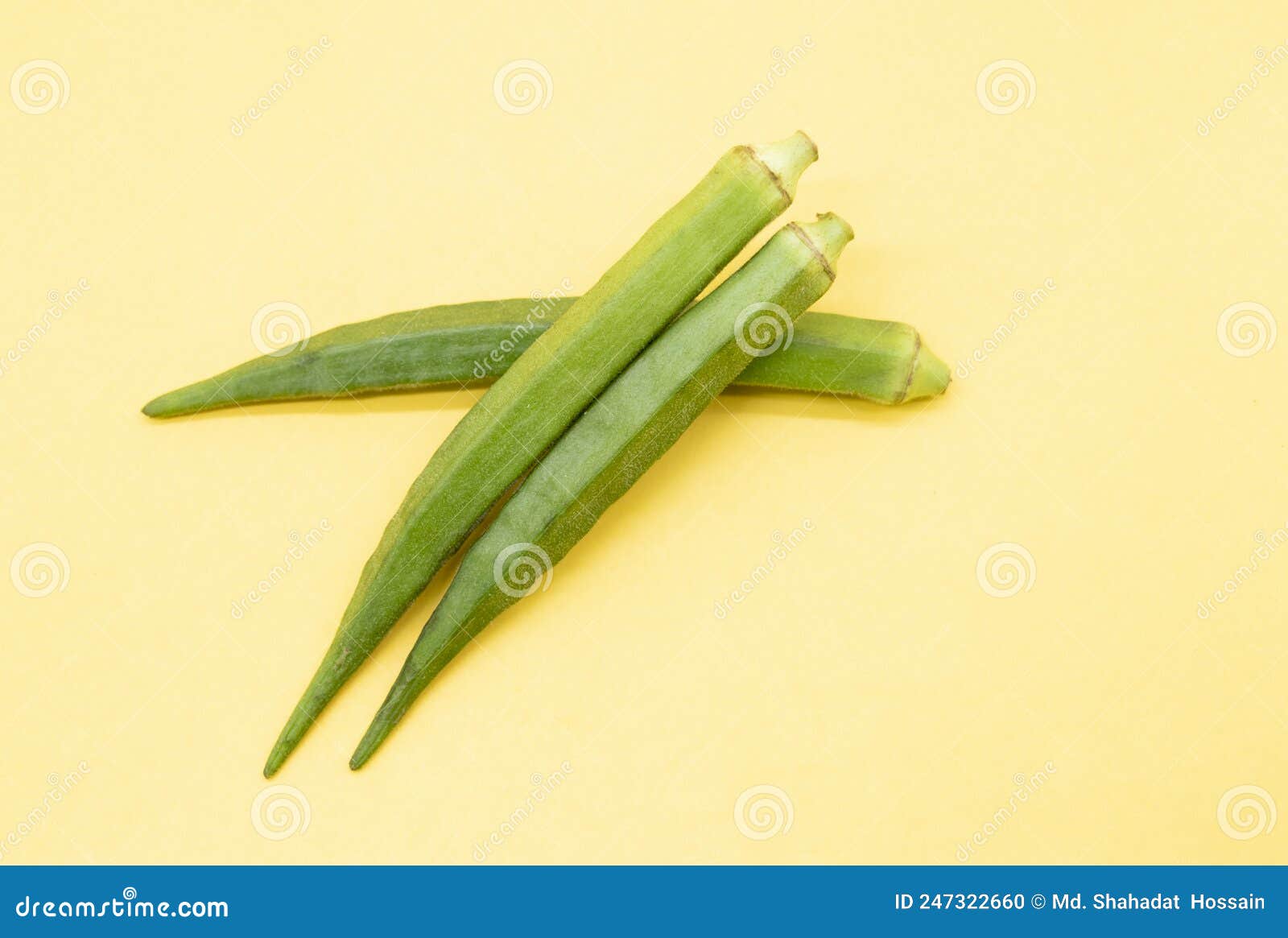 Fresh Okra Isolated on Yellow Background, Front View Stock Photo