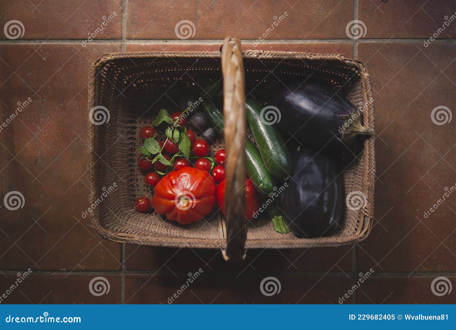 fresh and organic harvested vegetables in wicker basket