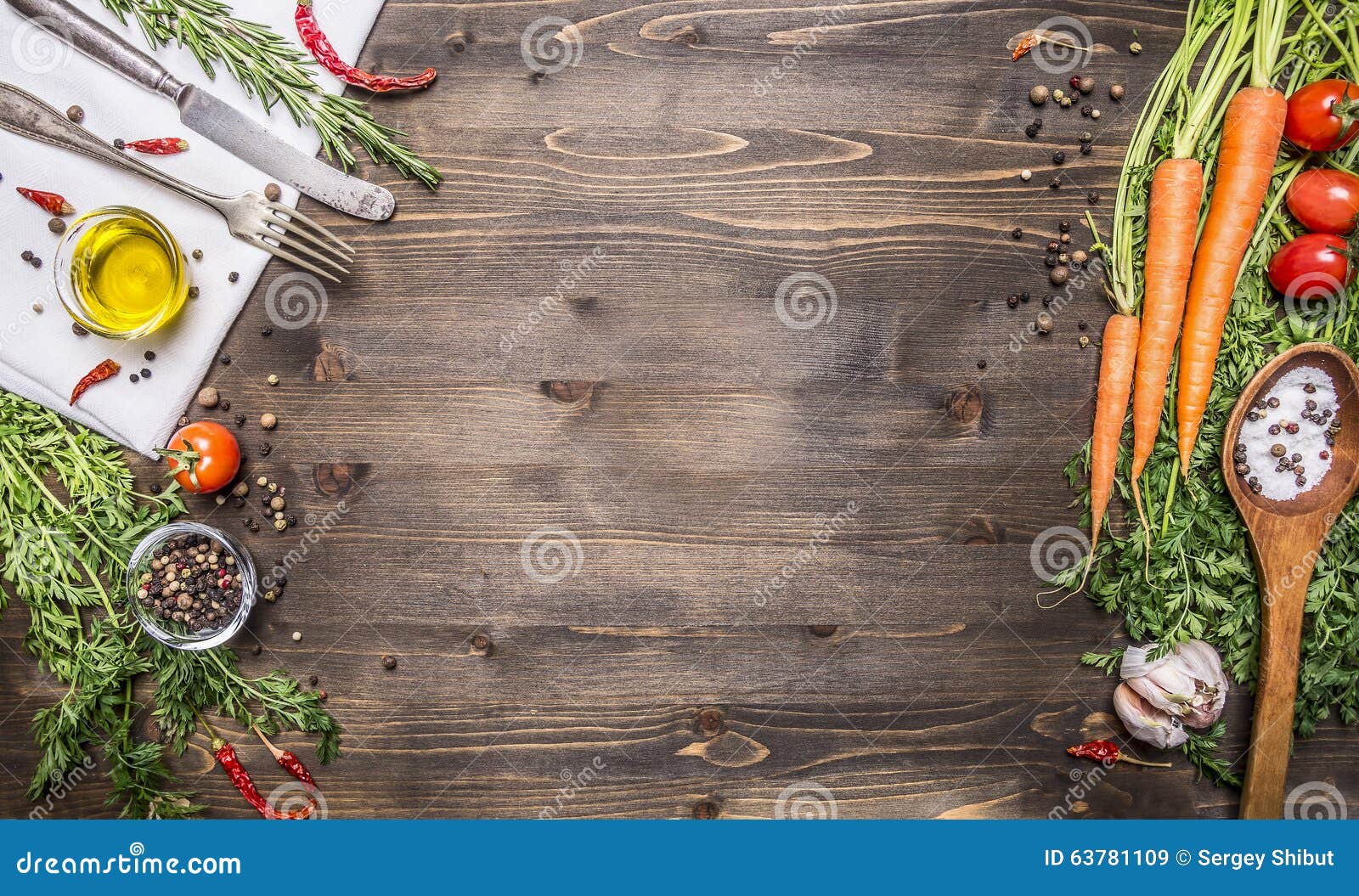 fresh organic vegetables and spoons on rustic wooden background, top view, border. healthy food or vegetarian cooking concept
