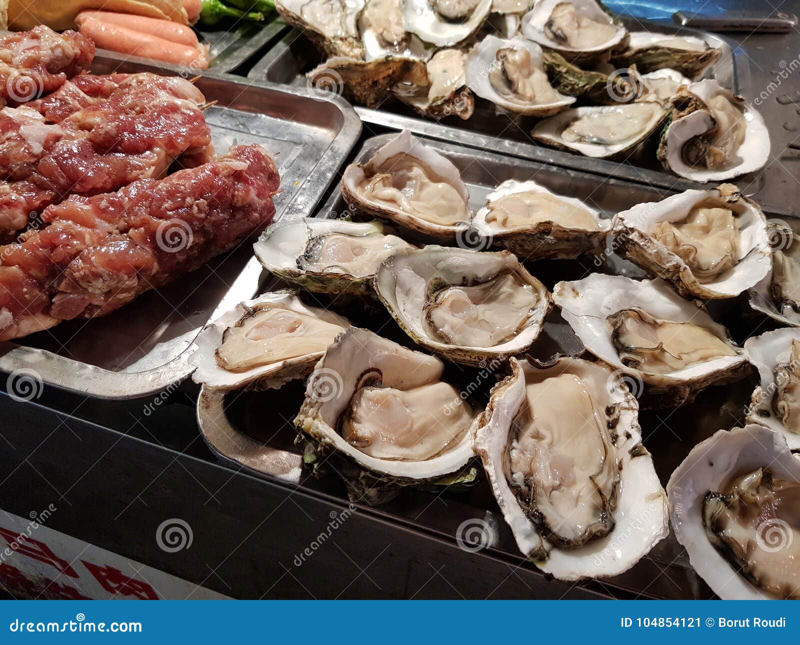 Fresh oysters on the Grill stock image. Image of evergreen 104854121