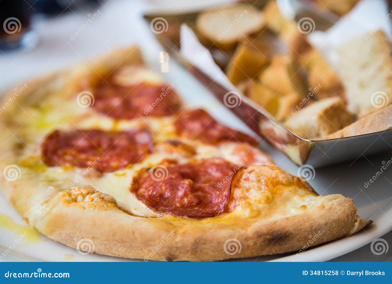 Pepperoni Roman Pizza Closeup. Pepperoni Pizza On Dark Concrete Table RoyaltyFree Stock Photo