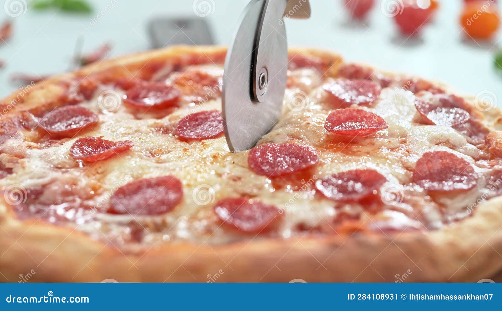 Fresh Pepperoni Pizza Cut Into Slices With Pizza Cutter In Slow Motion