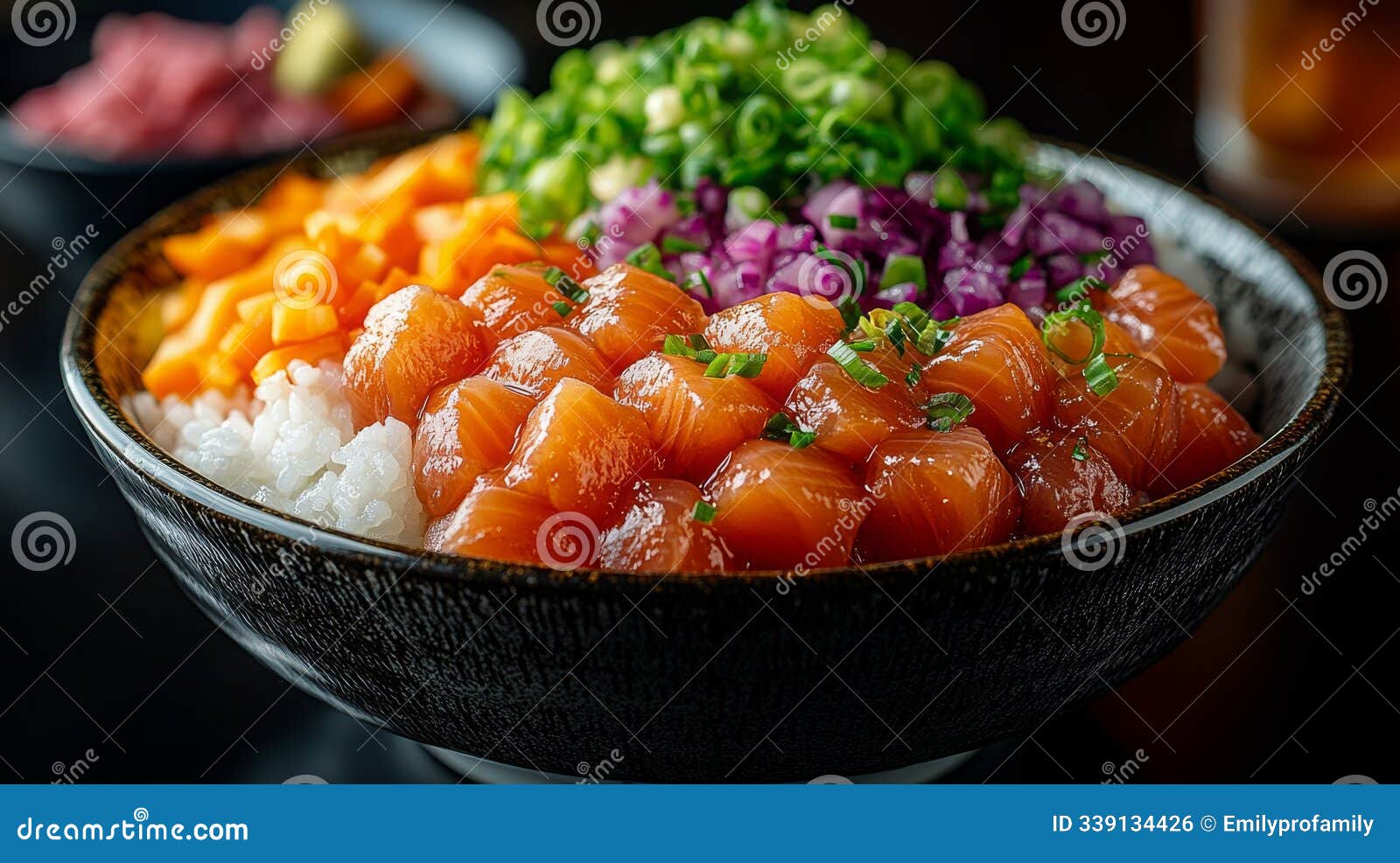 fresh poke bowl with salmon, mango, and green onions at a cozy restaurant setting