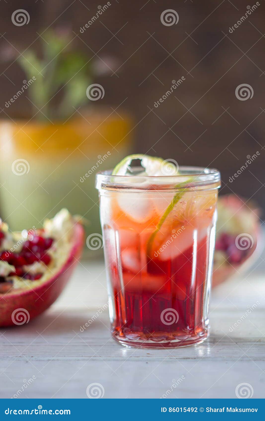 Fresh Pomegranate Drink Lemonade or Cocktail with Lime and Ice Stock