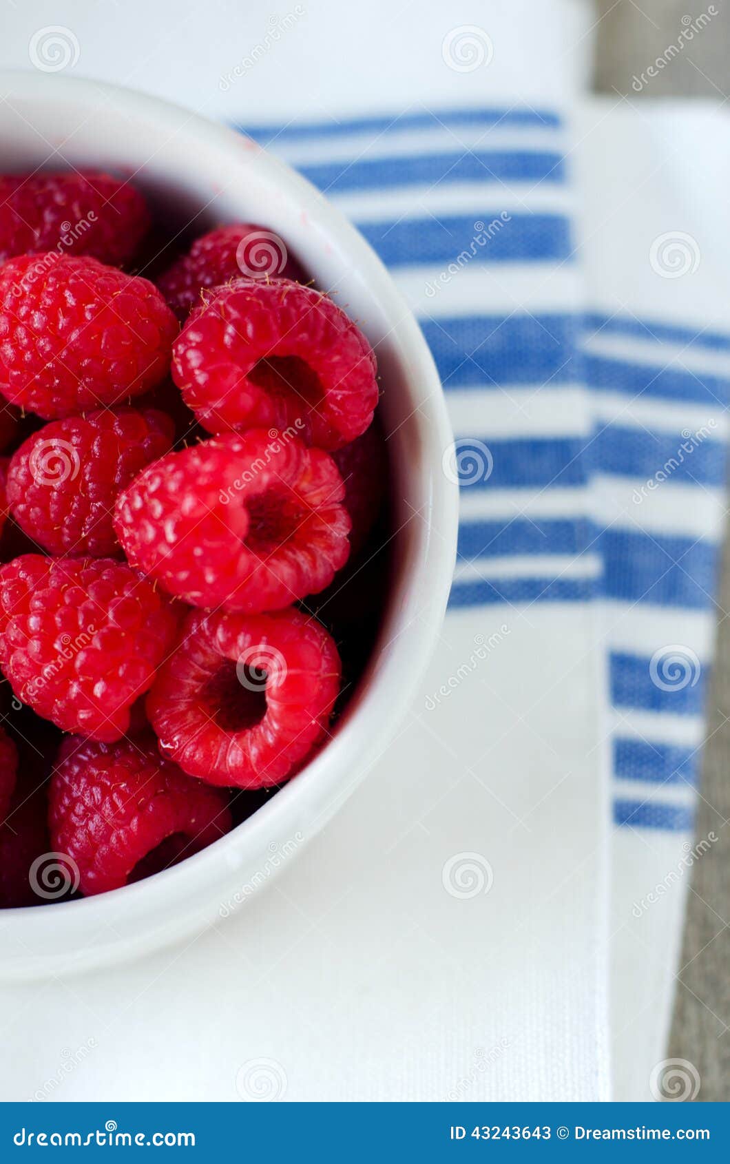 fresh rasperries in white bowl