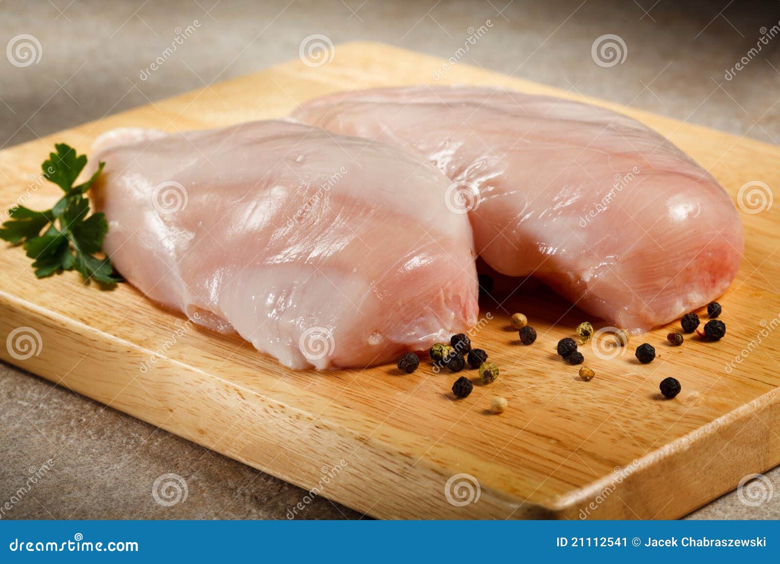 Fresh raw chicken breasts stock image. Image of parsley 21112541