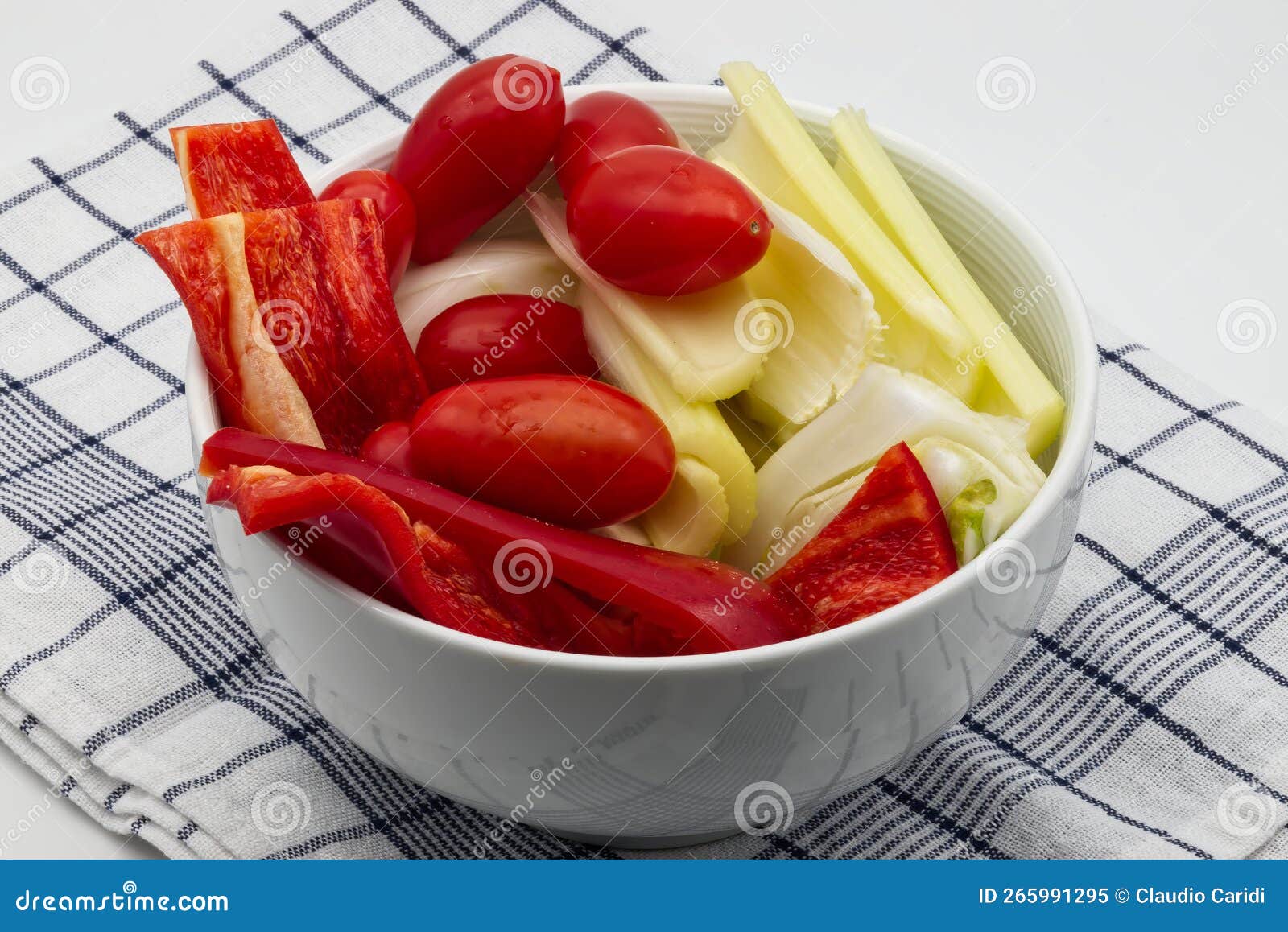 fresh and raw vegetables for italian pinzimonio on white wooden table. pinzimonio is often served as starter