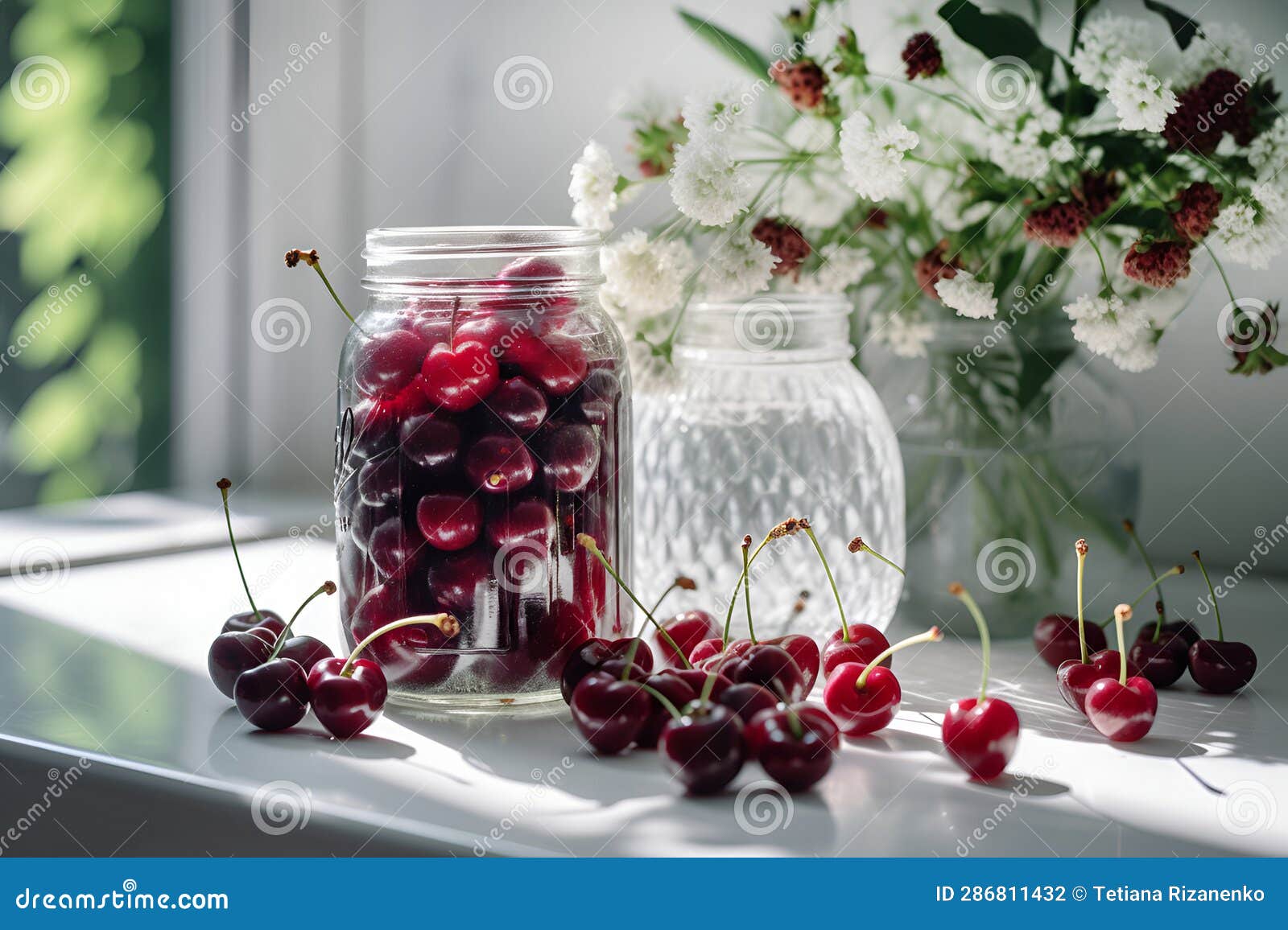 Fresh Ripe Cherries in a Glass Jar Surrounded with Fresh Cherries on a