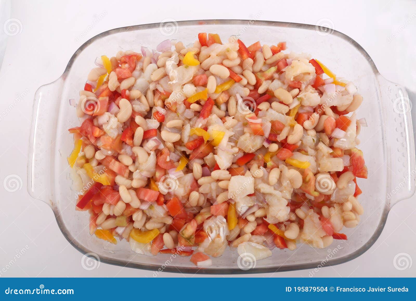 fresh summer salad with beans, cod, tomato and onions