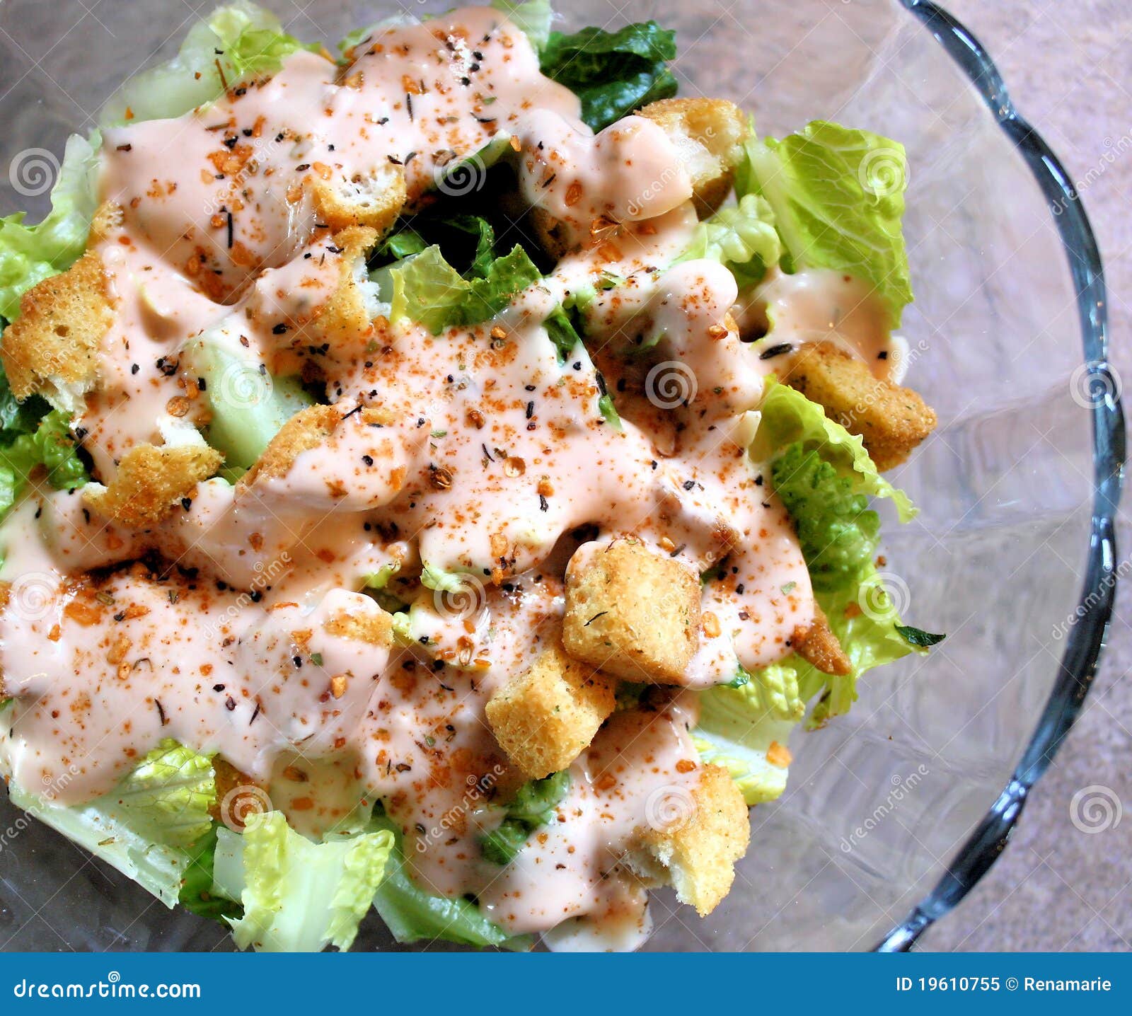 Fresh Salad With Croutons. Delicious garden salad. Romaine lettuce, croutons, salad dressing and flavoured spices.