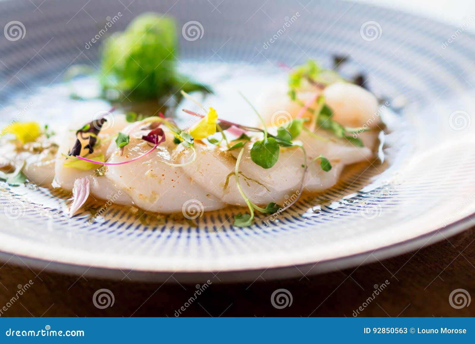 fresh scallops sashimi closeup.