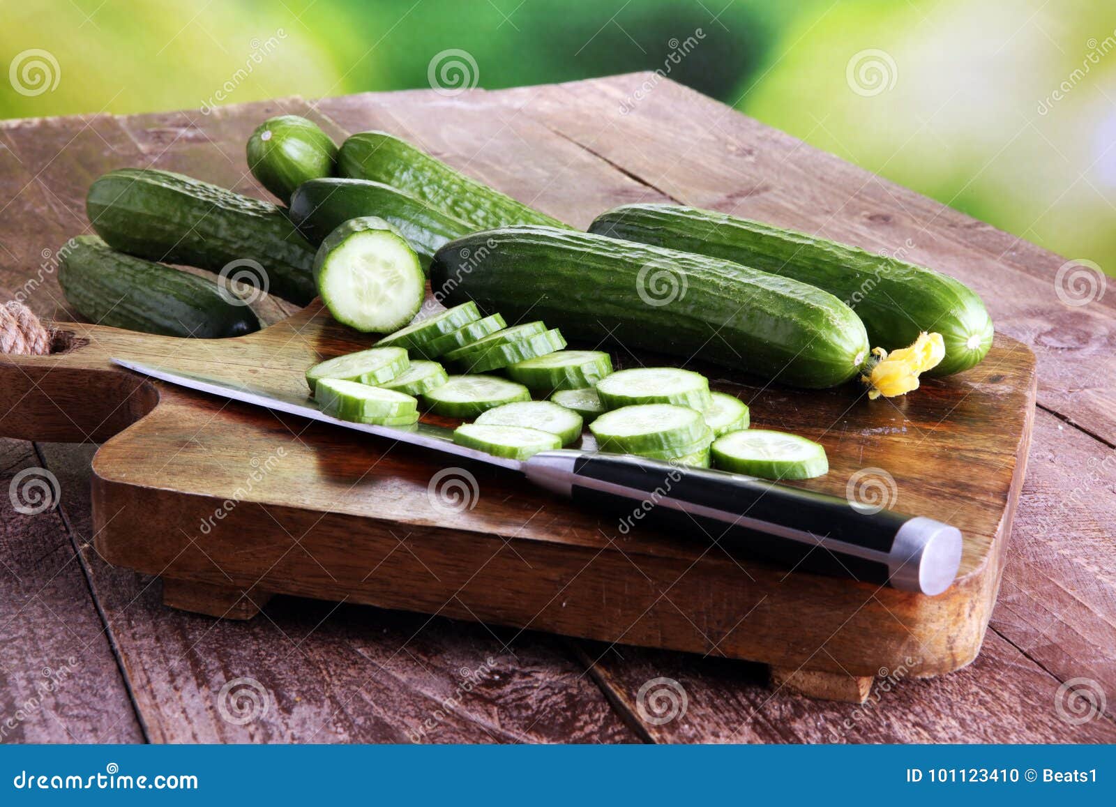 fresh and sliced cucumbers. sliced cucumbers on a cutting board.
