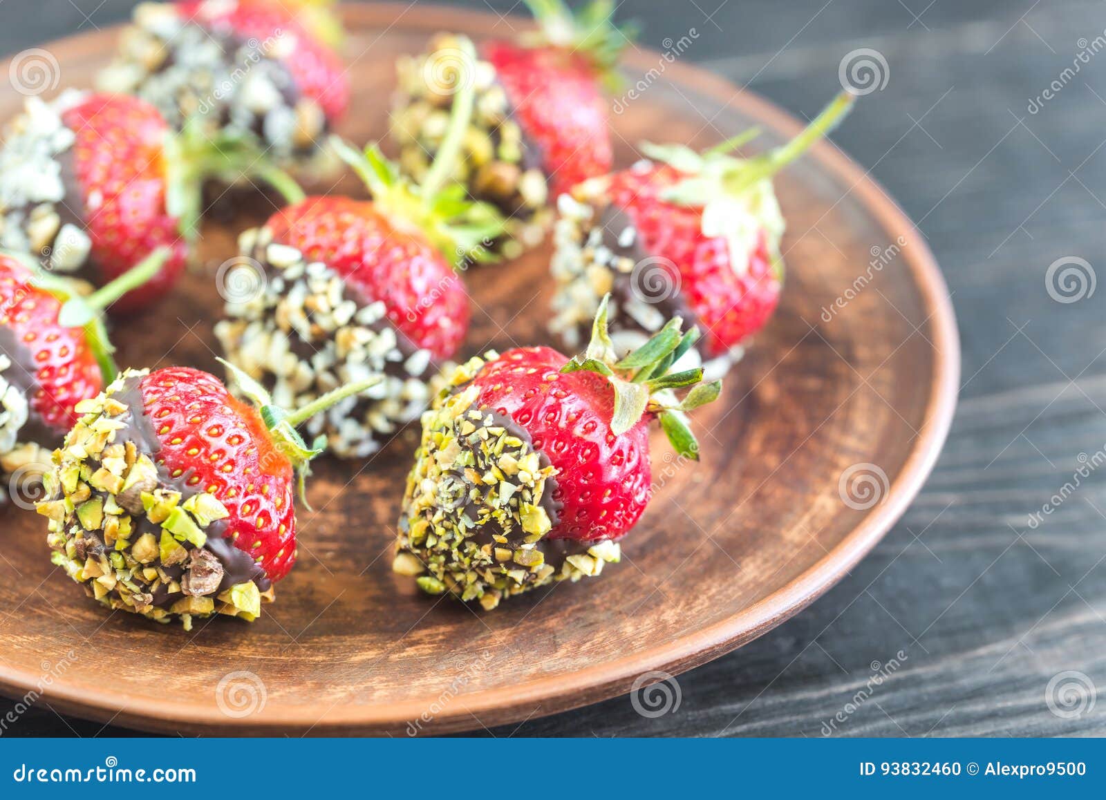 Fresh Strawberries Covered with Dark Chocolate and Nuts Stock Photo