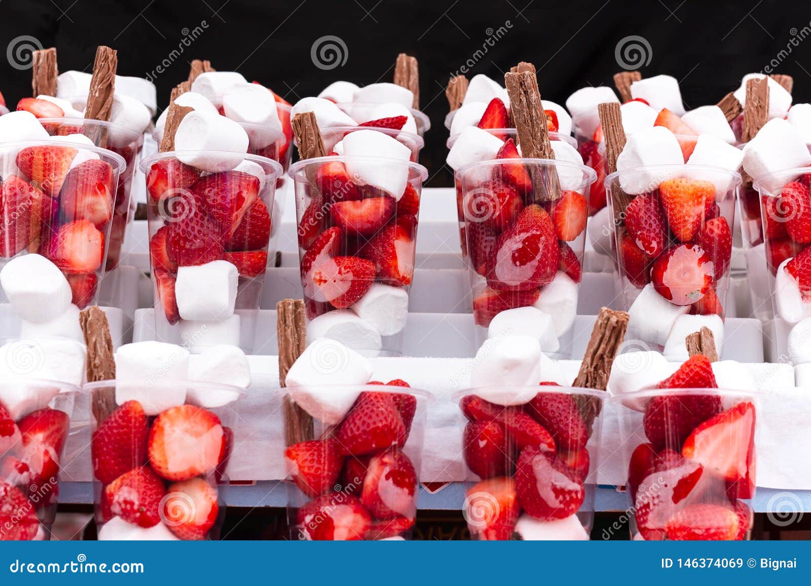 Fresh Strawberries with Marshmallow and Chocolate Stick in Plastic Cup