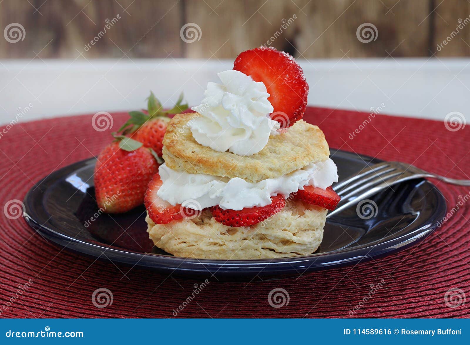 fresh strawberry shortcake with homemade biscuits and garnished