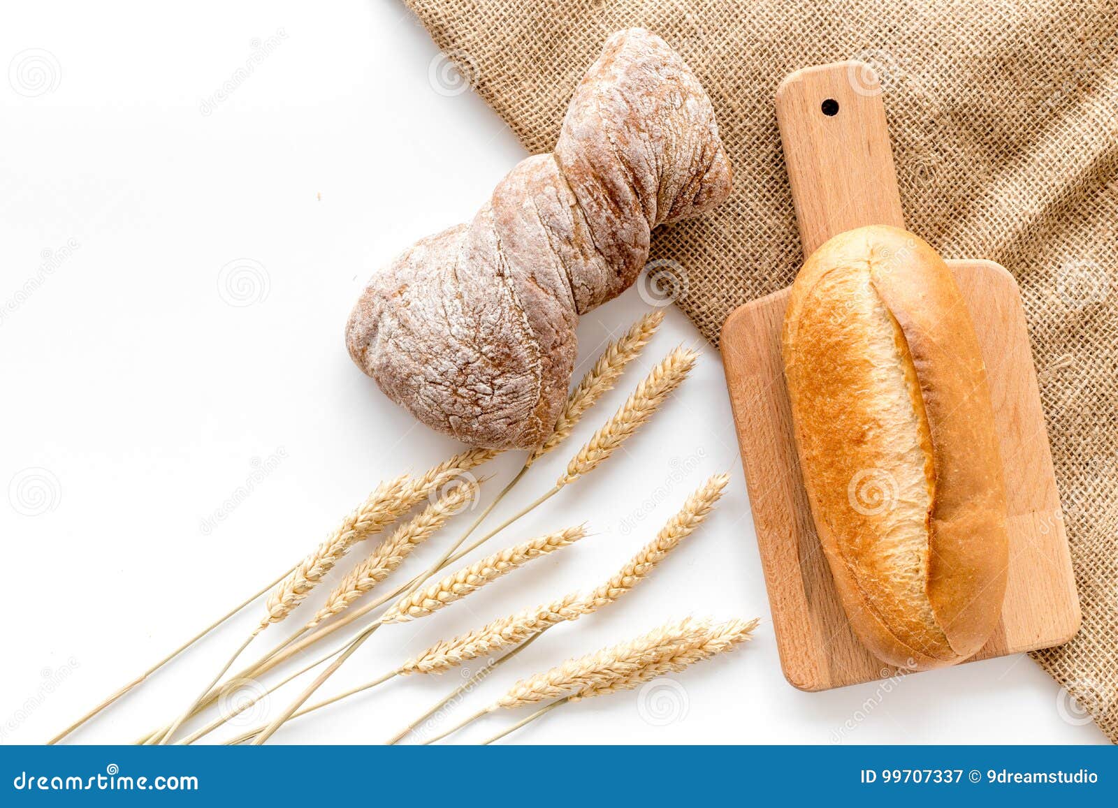 Download Fresh Bread With Wheat Flour In Bakery Shop On White Desk ...