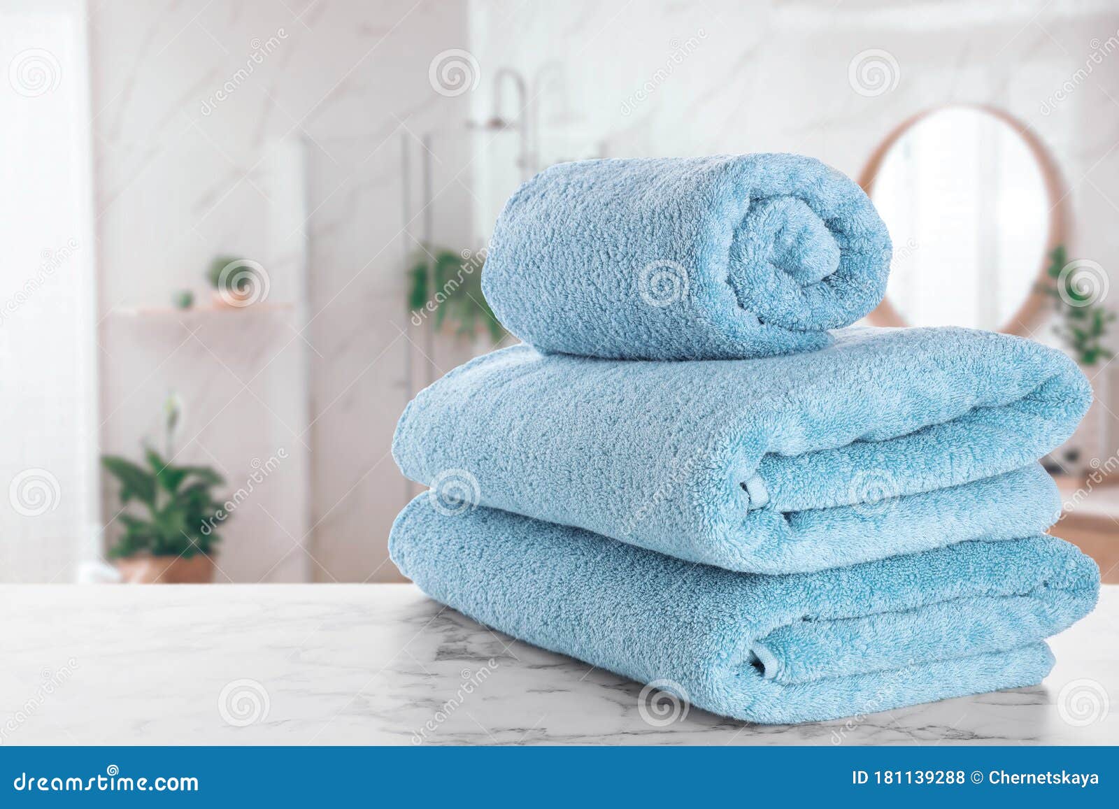 Fresh Towels on Table in Bathroom. Space for Text Stock Photo Image