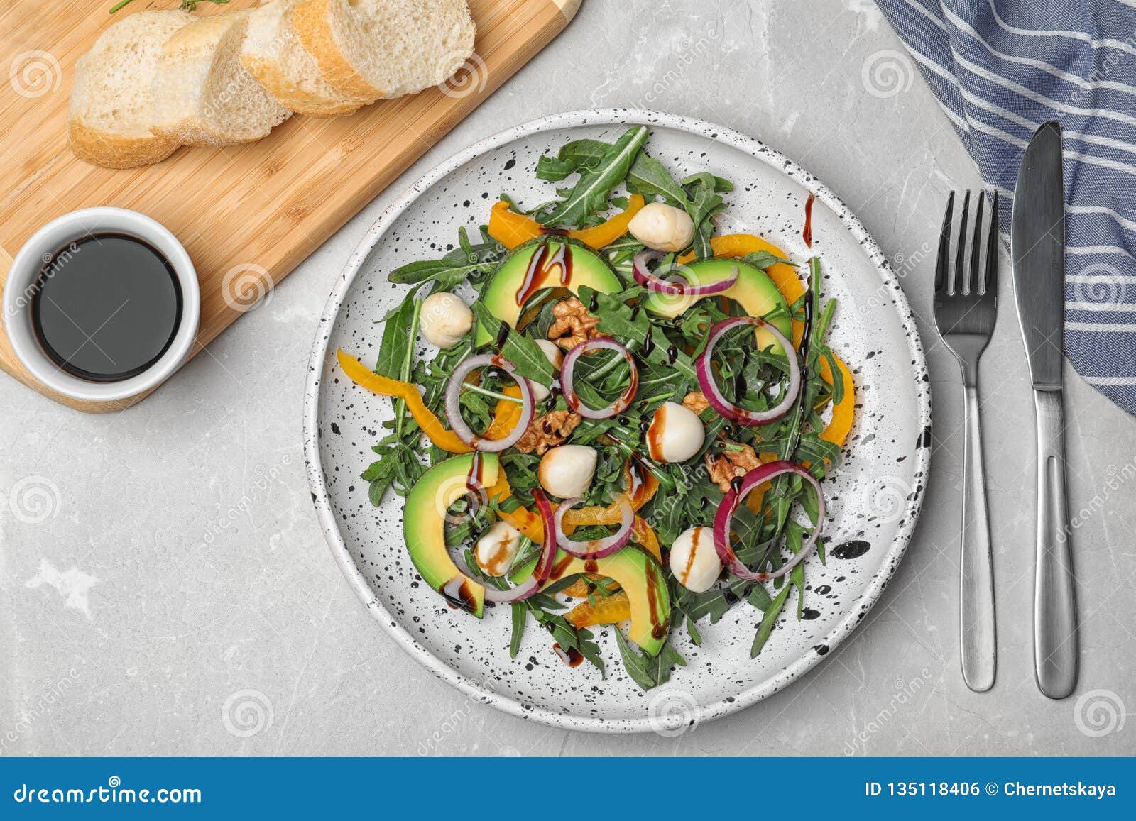 Fresh Vegetable Salad and Balsamic Vinegar Served on Table Stock Photo