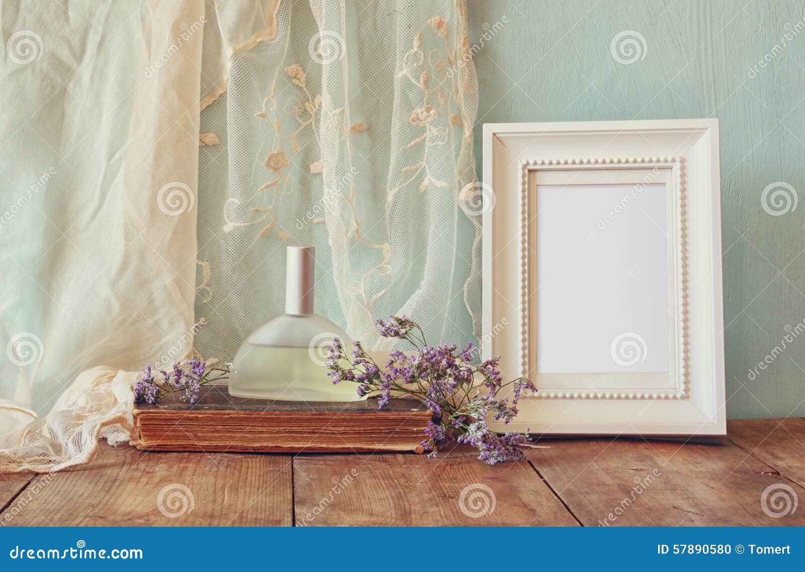 A bottle of perfume sitting on top of a table photo – Free Perfume