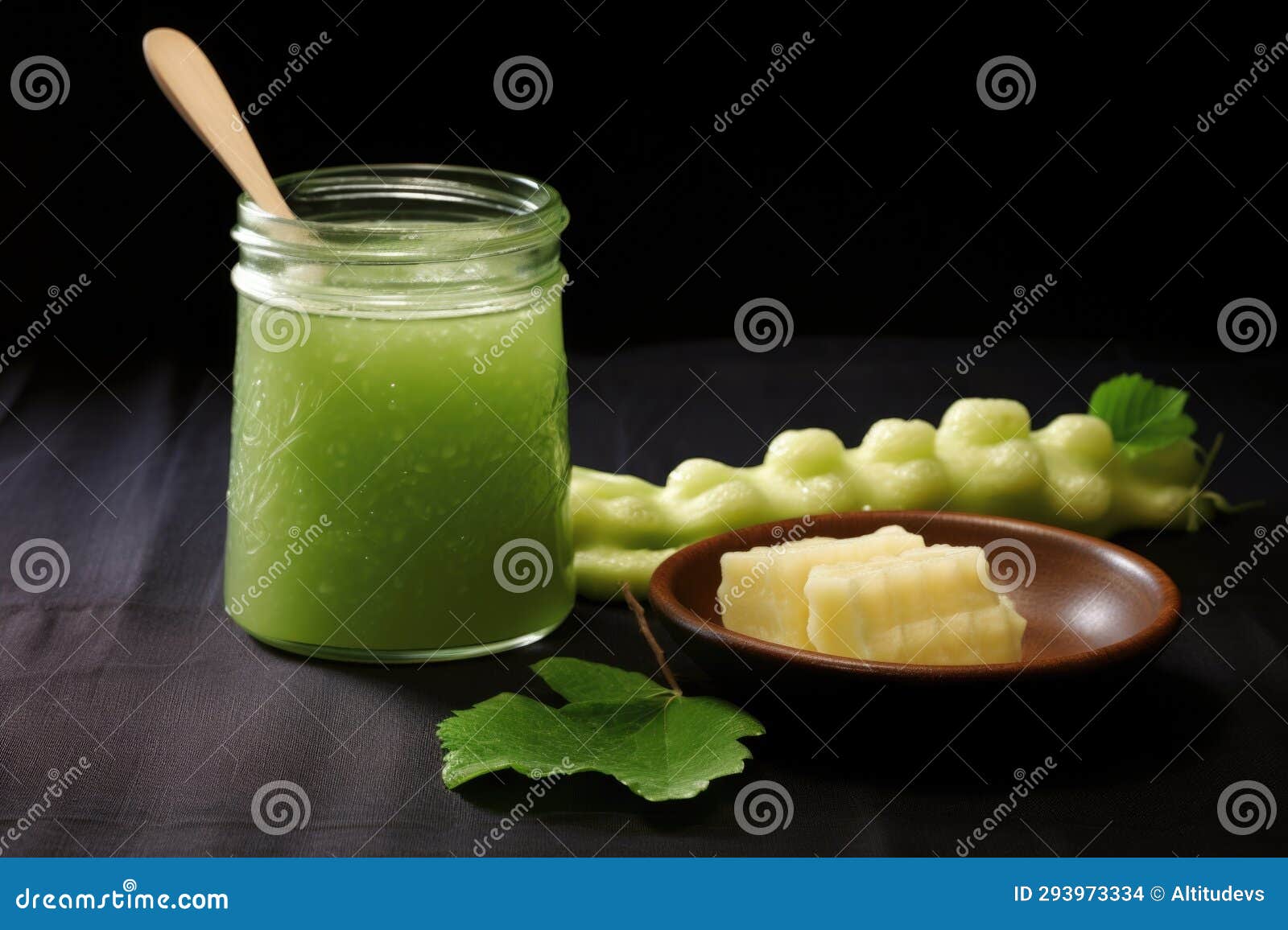 Fresh Wasabi Root with Droplets of Water, Next To a Jar of Wasabi Paste