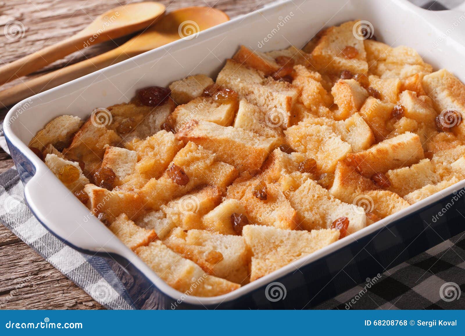 Freshly Baked Bread Pudding with Raisins Close Up in Baking Dish Stock