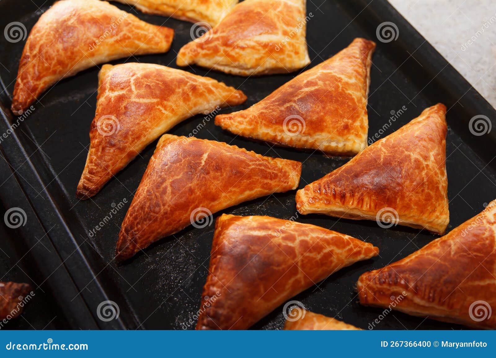 Freshly Baked Delicious Hot Patties Filled with Oven, Lie on a Baking