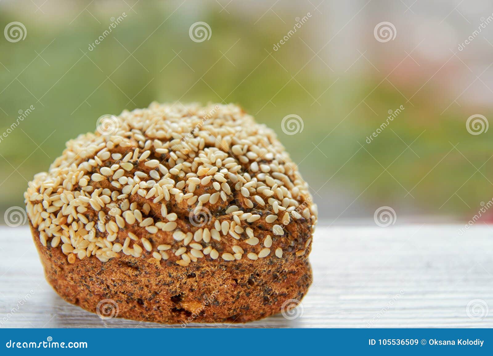 Freshly Baked Raisins Cake with Sesame Seeds Isolated on Gray Wooden ...