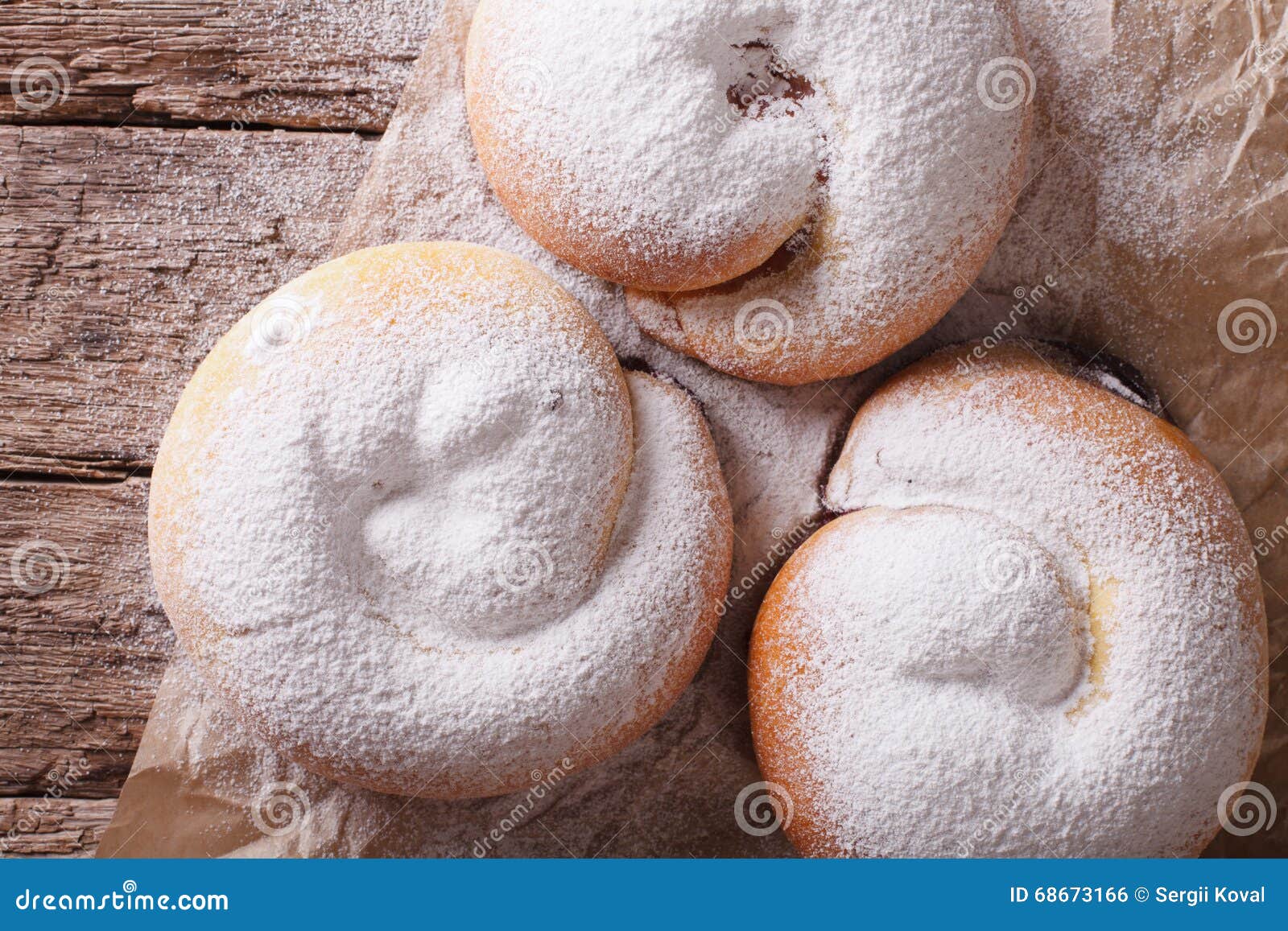 freshly baked sweet rolls ensaimadas close-up on the table. horizontal top view