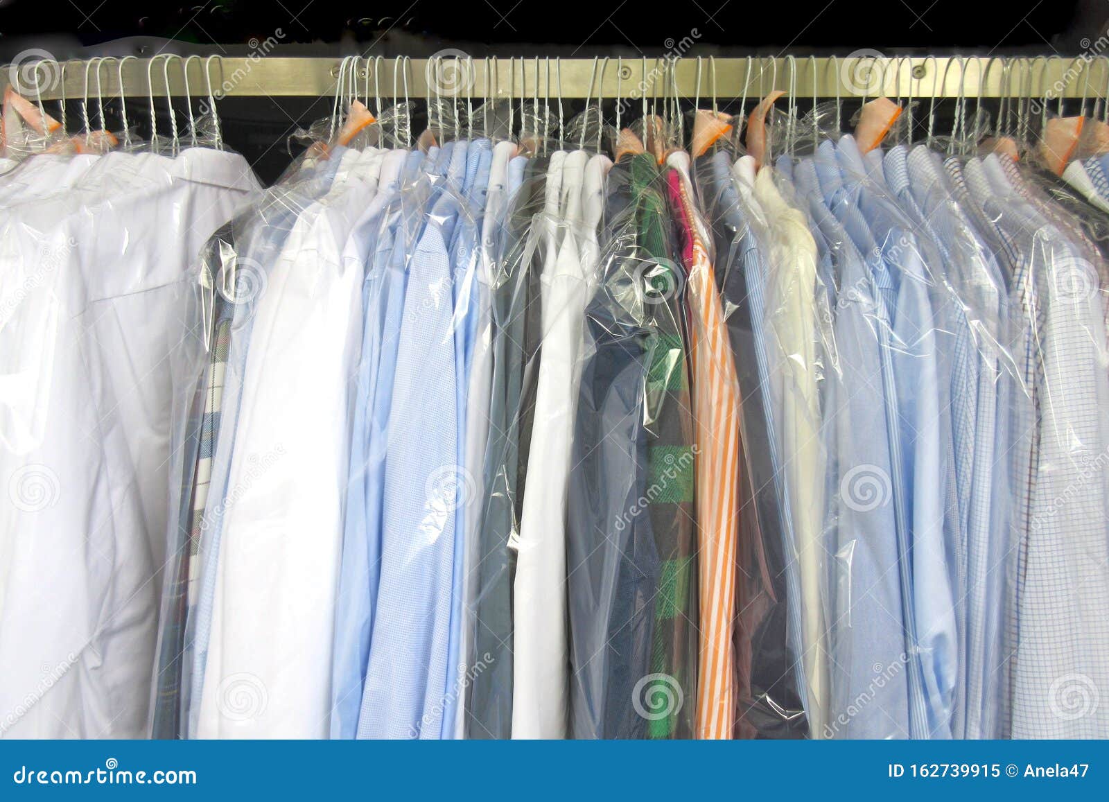https://thumbs.dreamstime.com/z/freshly-cleaned-men-s-shirts-ladies-blouses-dry-cleaning-hung-hangers-protected-plastic-film-ready-pick-up-162739915.jpg